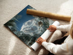 A woman carefully rolling a fine art poster paper print. The print showcases a beautiful snowy mountain landscape. This fine art paper ensures high-quality reproduction. Ideal for art collectors.