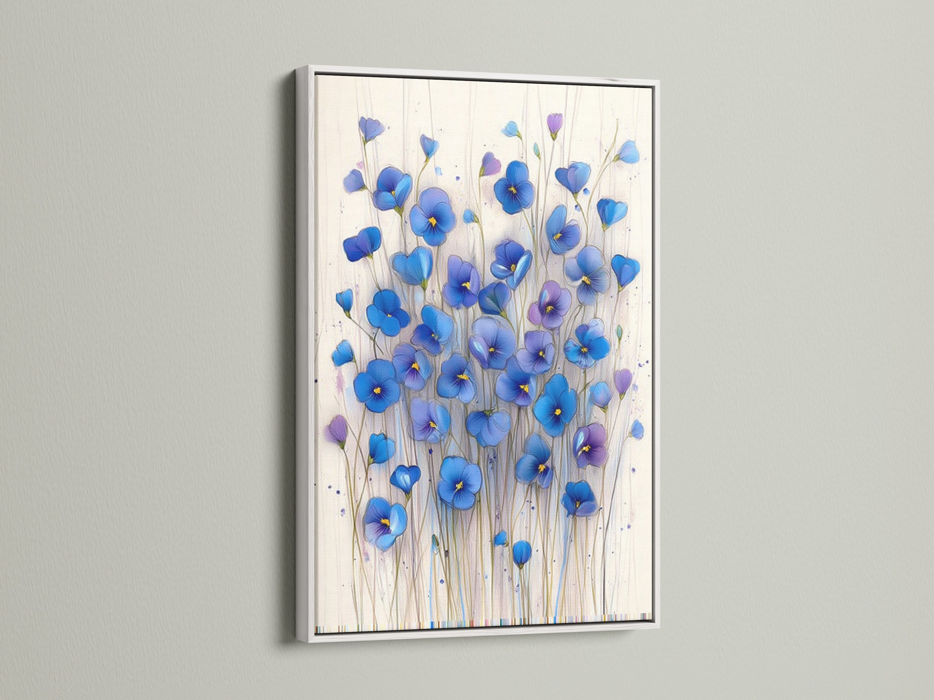 This is a white frame showcasing a blue floral canvas. The botanical wall decor brings a modern touch to any space. Perfect as flower artwork for a living room or office. Enjoy the beauty of this indigo art print.
