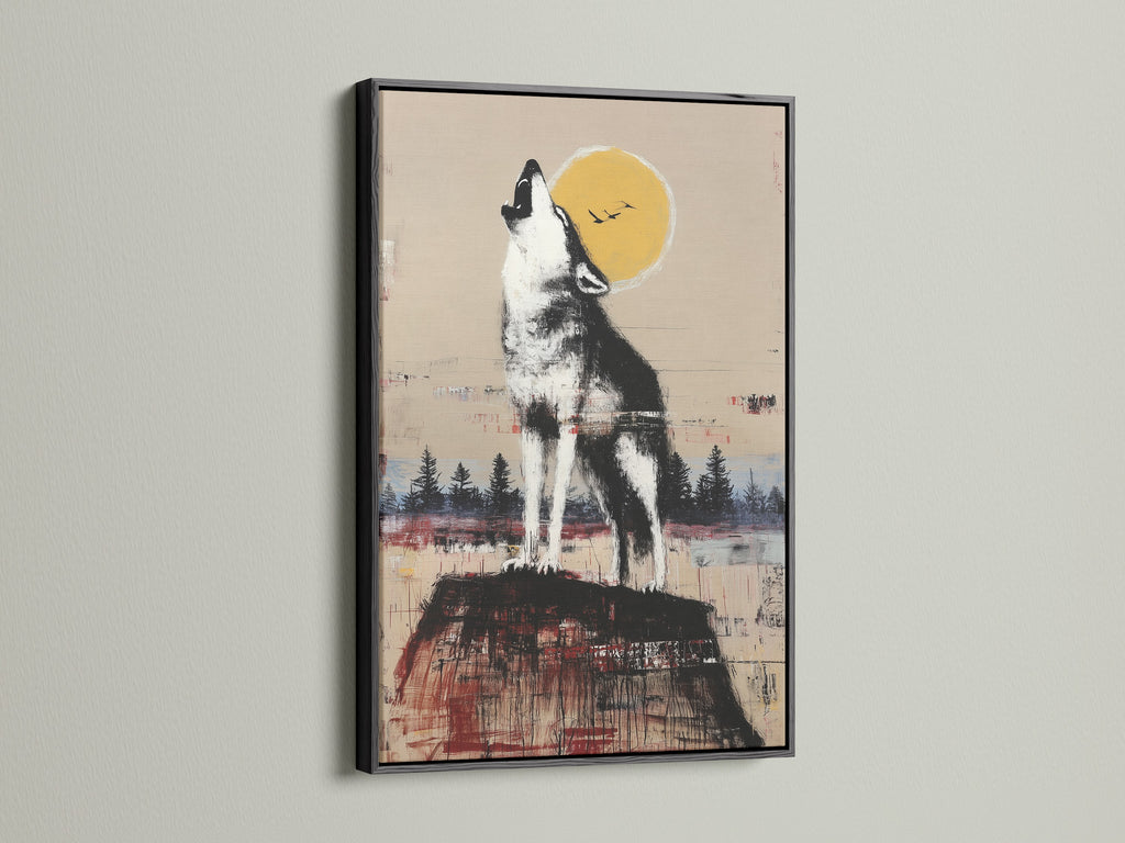 Rustic wildlife wall art featuring a howling wolf under the moon. The artwork is framed in a black frame. Add a touch of wilderness to your home with this wolf artwork. Ideal for rustic wall art and cabin decor. This art is perfect for studies or lounges.