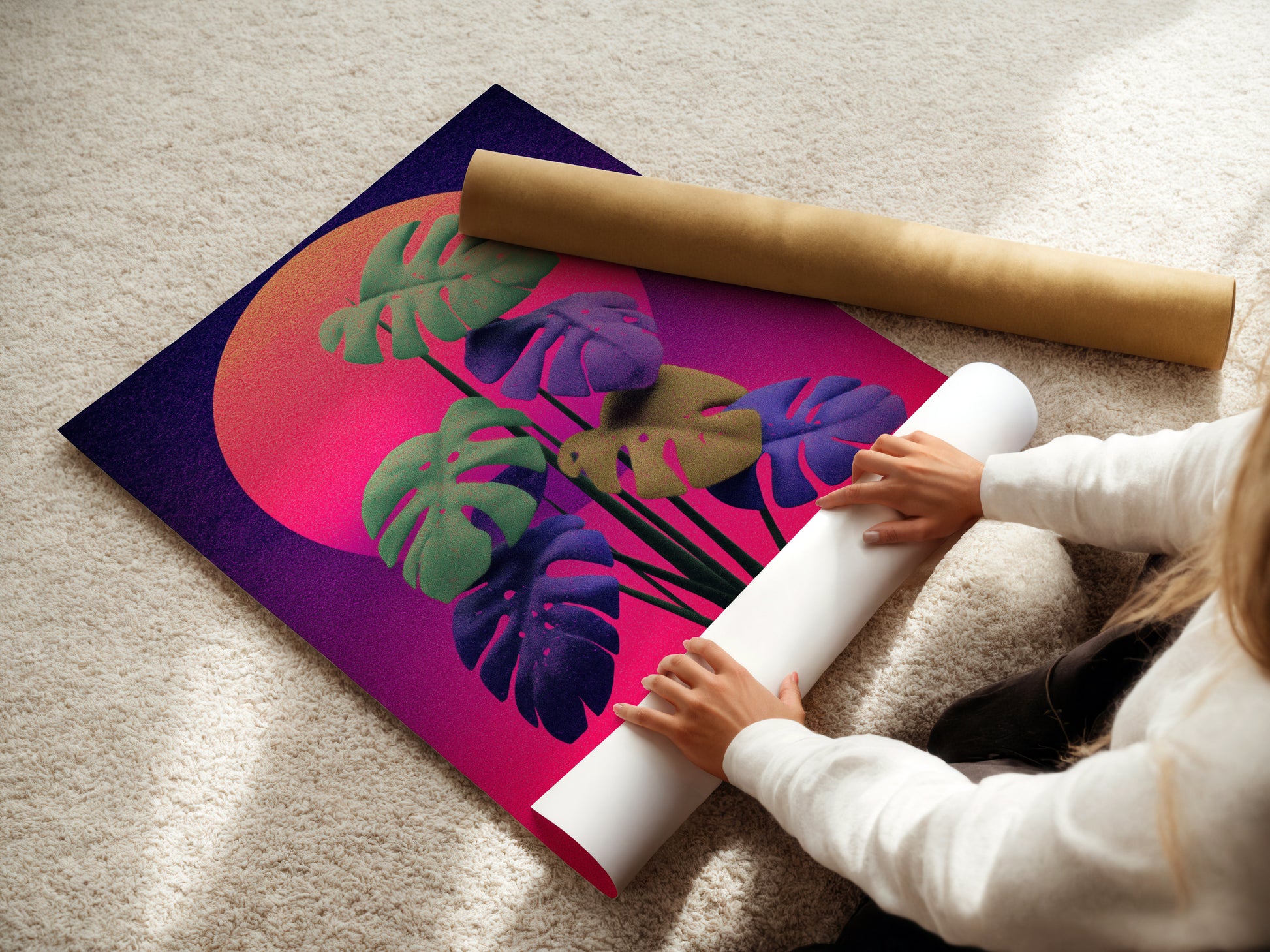 A woman is carefully rolling a fine art poster paper. She is handling a monstera retro sunset print. This high-quality paper ensures the artwork's colors remain vibrant. Perfect for preserving your botanical art.