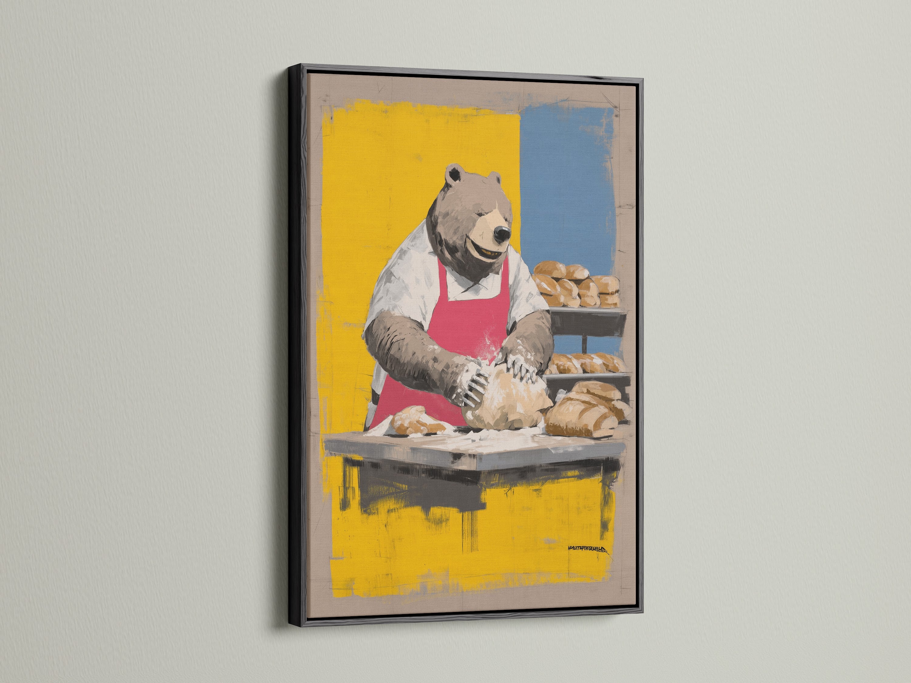 Bear Baker Canvas Print in a black frame is displayed. This chef animal print is perfect for kitchen wall art. Its bakery wall decor adds a unique touch to any space. Ideal for a rustic dining room. Homeowners and cafe owners will love this whimsical art.