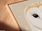 Angled close up of a canvas print in floating frame. This owl artwork is displayed beautifully. It enhances the modern bird wall art aesthetic. A great addition to any nursery. Its neutral tones blend seamlessly with scandi decor.