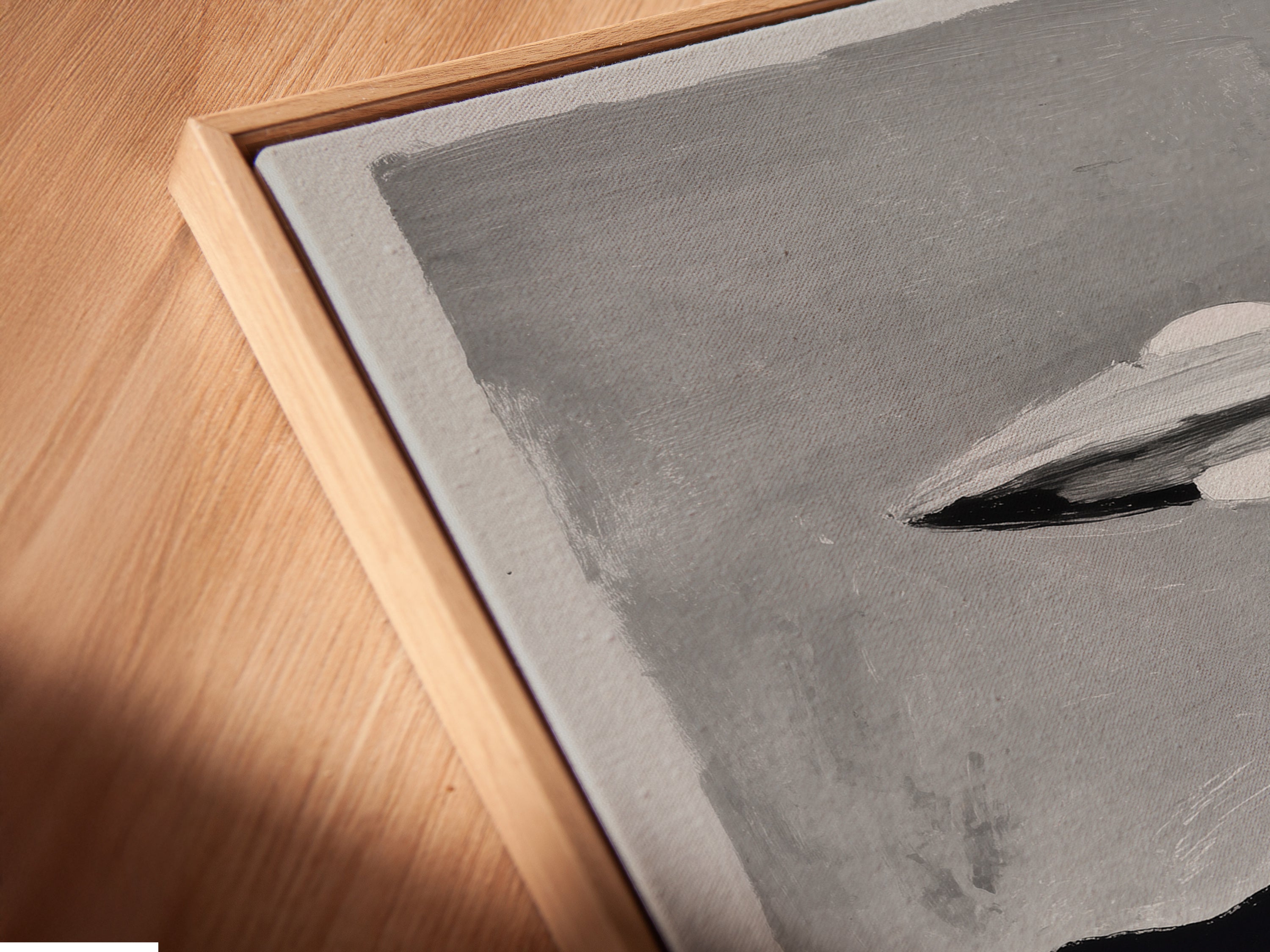 Angled close up of a canvas print in a floating frame. This UFO Sci-Fi art print is perfect for adding a touch of extraterrestrial art to your space. The floating frame enhances the minimalist feel.