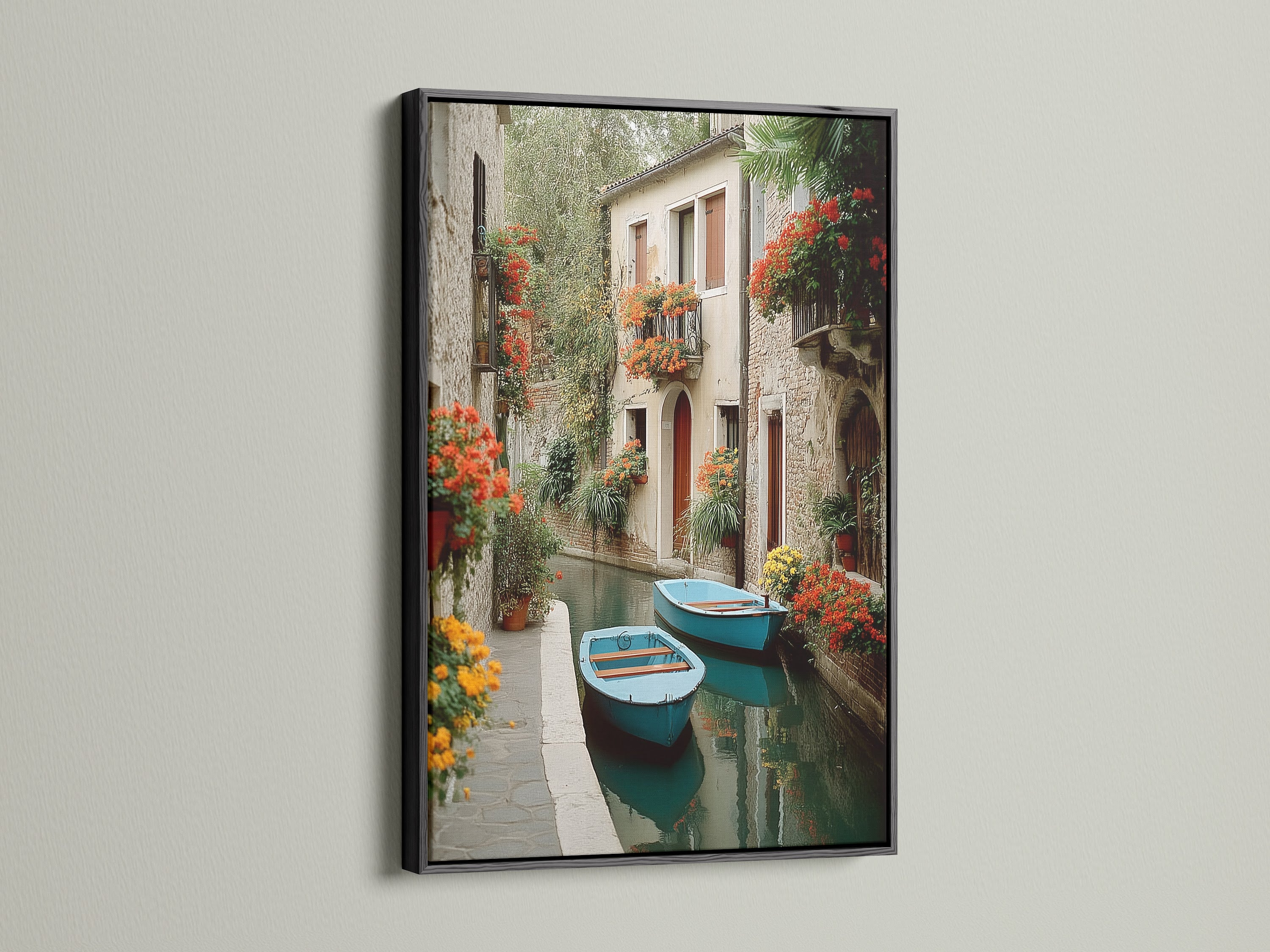 Venice Canal artwork with a sleek black frame. The canal canvas captures the essence of Venetian style. Perfect for adding a touch of Europe to your home decoration. A timeless piece of travel art.