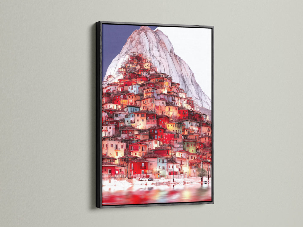The Mountain Village artwork is presented in a black frame. A bold choice for this European village artwork. The black frame adds contrast to the red teal decor in this hillside print.