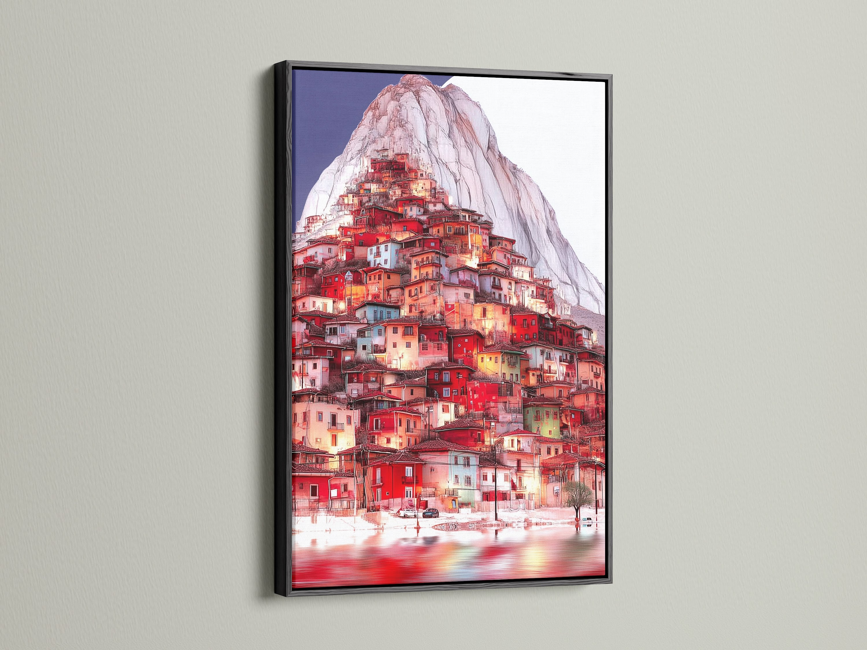 The Mountain Village artwork is presented in a black frame. A bold choice for this European village artwork. The black frame adds contrast to the red teal decor in this hillside print.