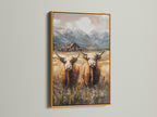 Highland cow print showcased in a gold frame. Elevate your farmhouse decor with this rustic yet elegant artwork. Perfect for adding a touch of Scottish charm to any room.