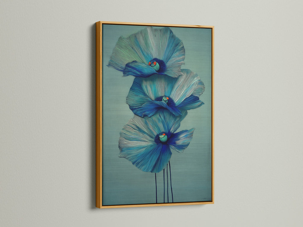 A stunning blue flower artwork is displayed in a gold frame. This floral canvas print adds a touch of luxury to your decor. Browse our selection of modern art prints. Perfect for bedroom wall decor and scandi decor.