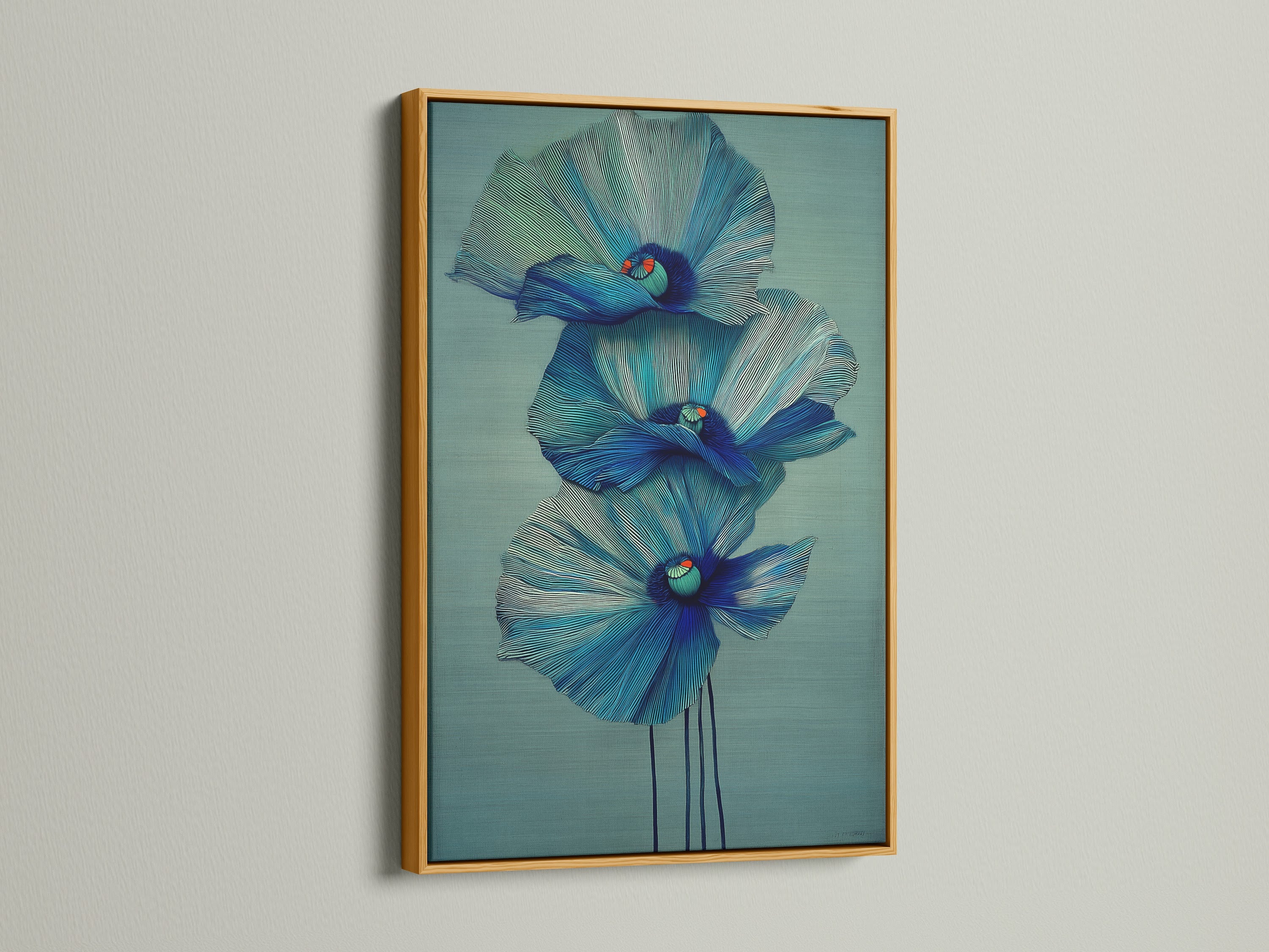 A stunning blue flower artwork is displayed in a gold frame. This floral canvas print adds a touch of luxury to your decor. Browse our selection of modern art prints. Perfect for bedroom wall decor and scandi decor.