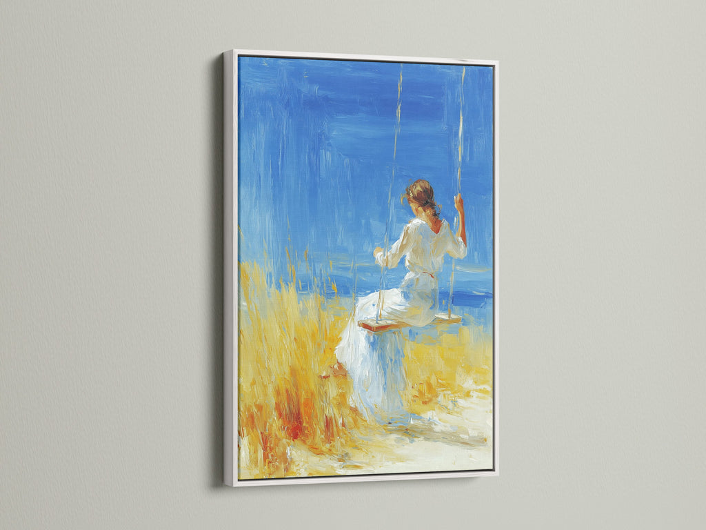 Artwork with a white frame is displayed. The artwork features a woman in a white dress sitting on a swing. The background shows a blue sea and yellow field. The white frame offers a clean and modern look. It highlights the artwork without overpowering it.
