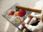 A woman is rolling a fine art poster paper. This high-quality paper showcases the spiral flower artwork beautifully. Choose this option for a lightweight and affordable art solution. Get yours today.