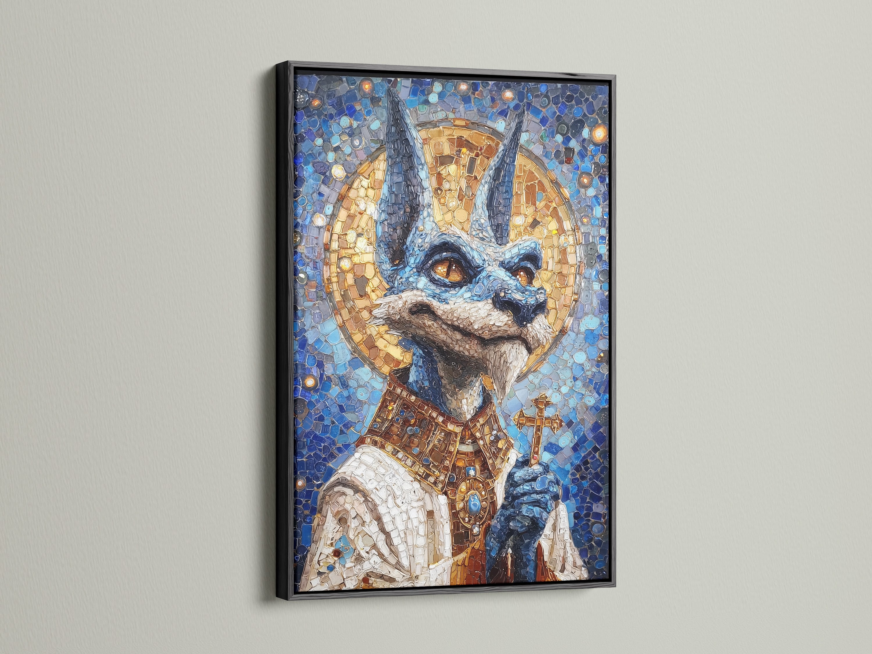 Anubis Mosaic Artwork Print with a black frame. The artwork is an Egyptian God Wall Art piece. It features blue and gold religious imagery. Perfect gothic art for libraries. A black frame adds a touch of sophistication.