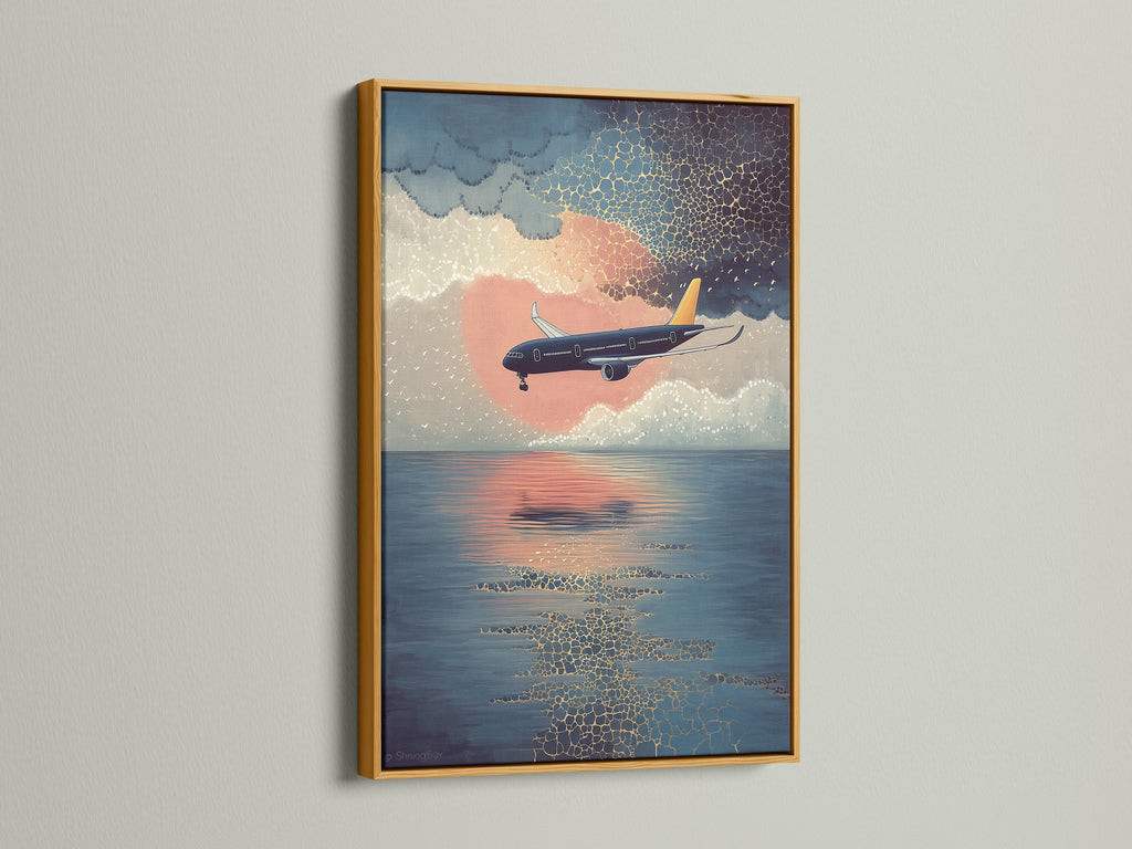 Elevate your space with our airplane canvas print. This sunset flight wall art features a coastal sky artwork. It is displayed in a gold frame. Perfect aviation poster for office decor. A modern print that brings blue orange art to life.
