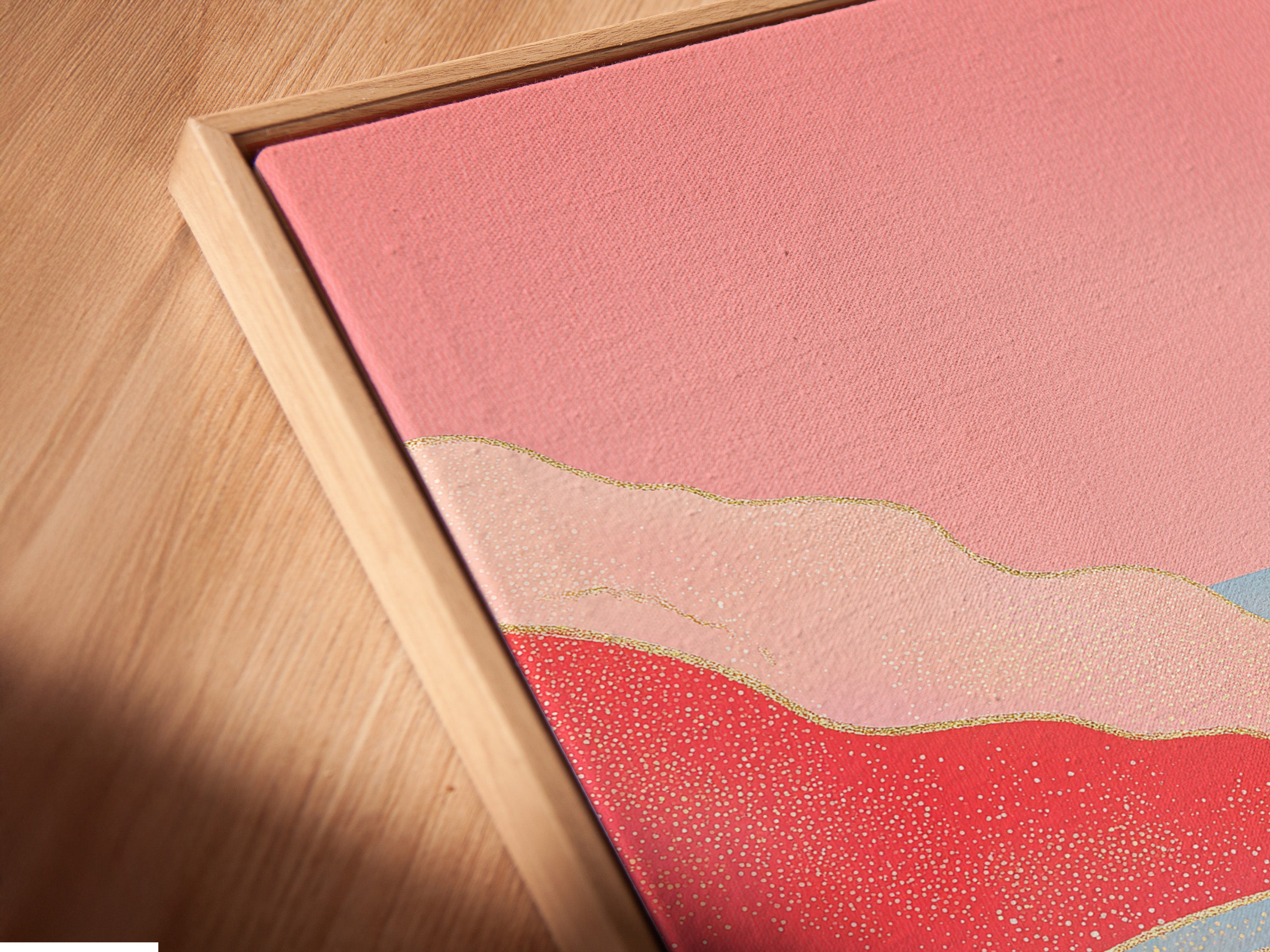 A close-up of a canvas print in a floating frame. The abstract river and pink mountain art create a modern look. Perfect contemporary art for living room wall art or creative workspaces. This nature print is a must-have.