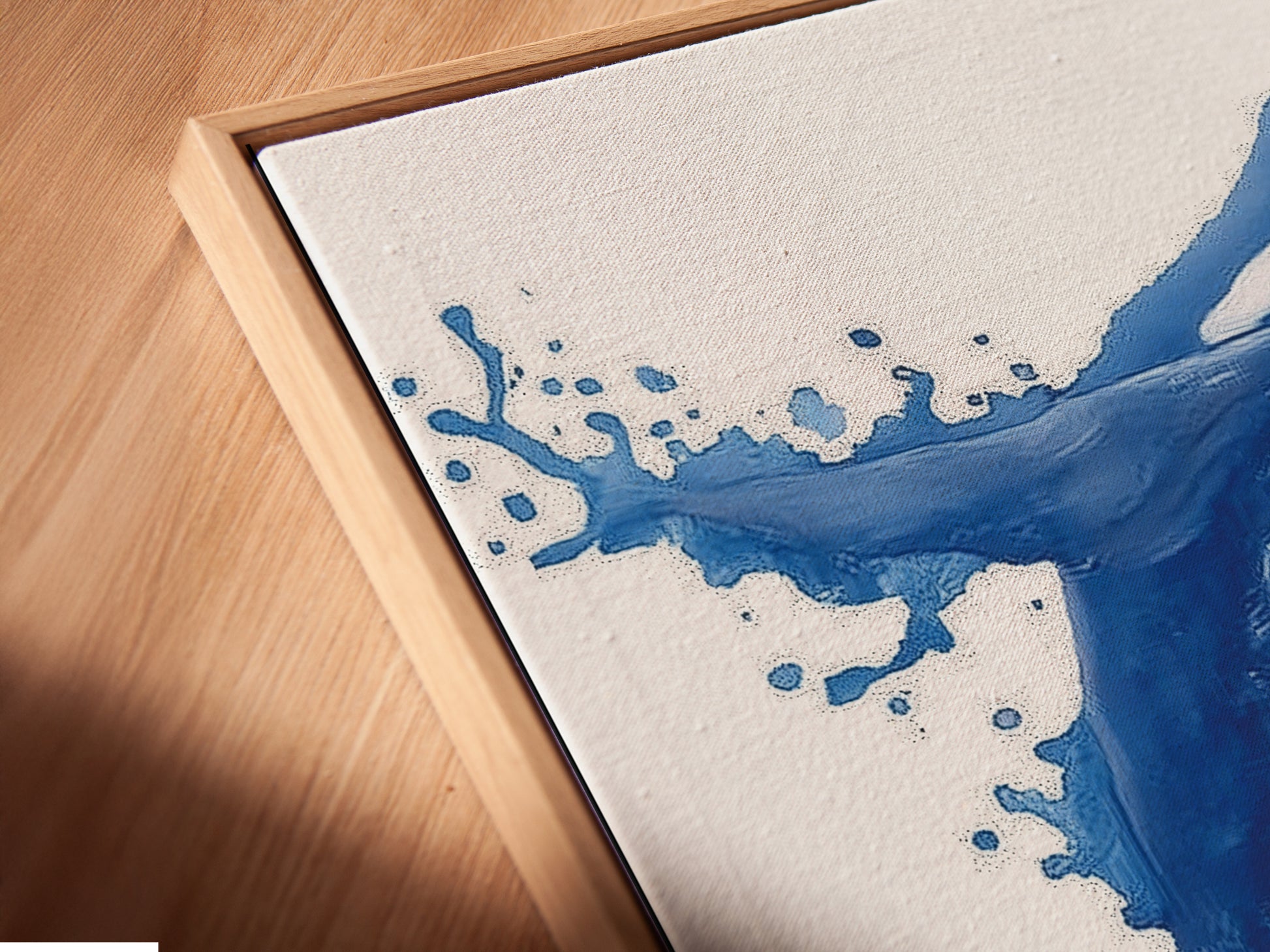 Get a close-up view of our canvas print in a floating frame. The indigo blue whale artwork adds depth and style to your walls. This coastal art enhances any room. Perfect for nautical minimalist or Scandinavian decor. Experience the beauty of fine art in your home today.