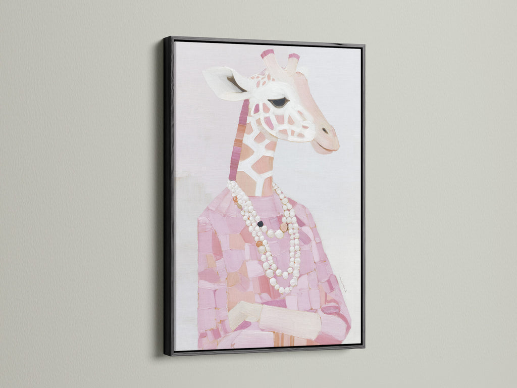 A black frame presents a Giraffe Portrait Canvas Print. The pink animal print creates a chic look. Fashion giraffe art is perfectly framed with a pearl necklace. Black frame contrasts beautifully with blush pink art. This stylish animal art is striking.