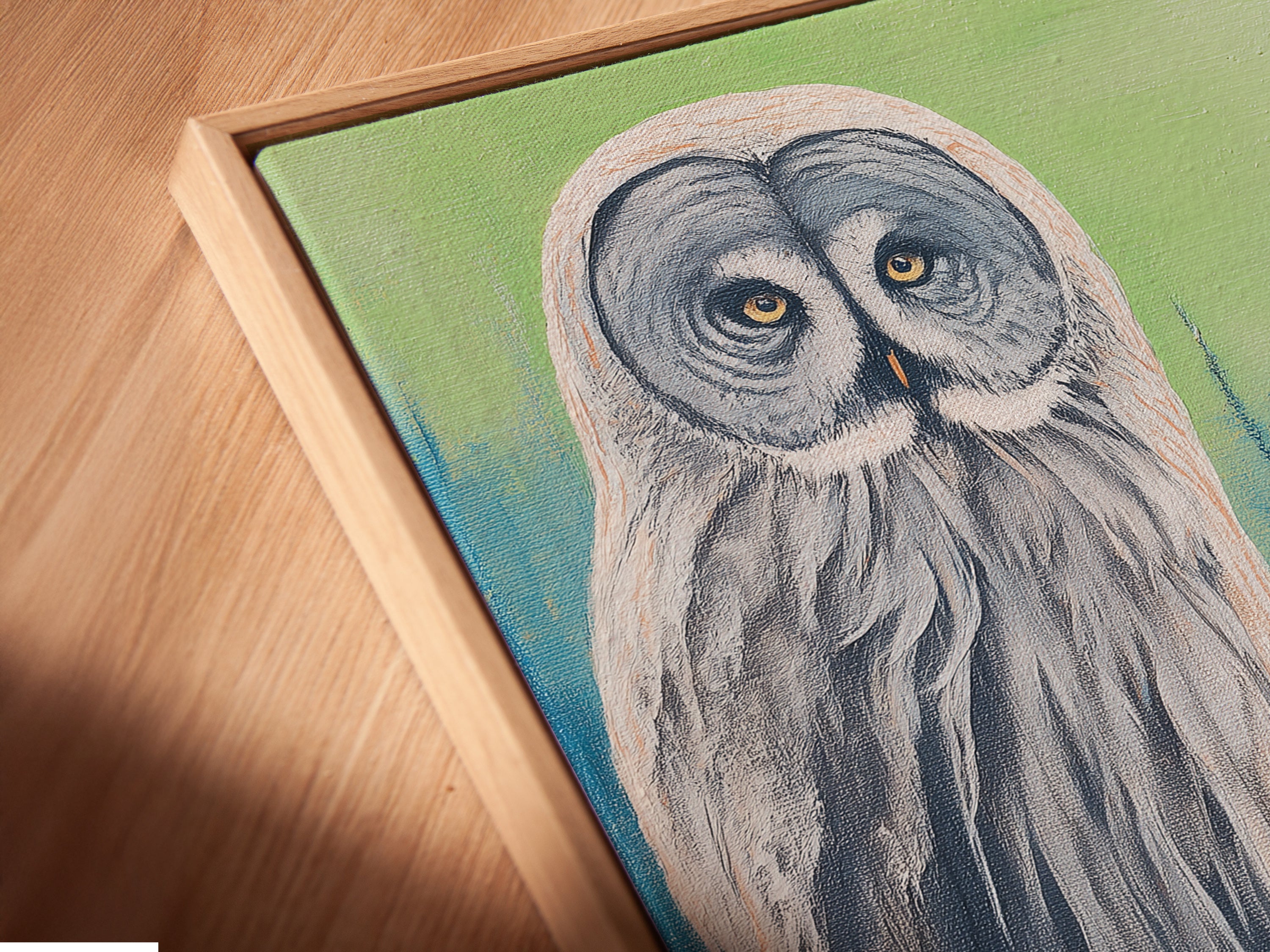 Close up angled view of a canvas print in floating frame. The floating frame gives the artwork a gallery-like feel. Perfect for showcasing this winter forest wall art. See the details of this woodland creature artwork.