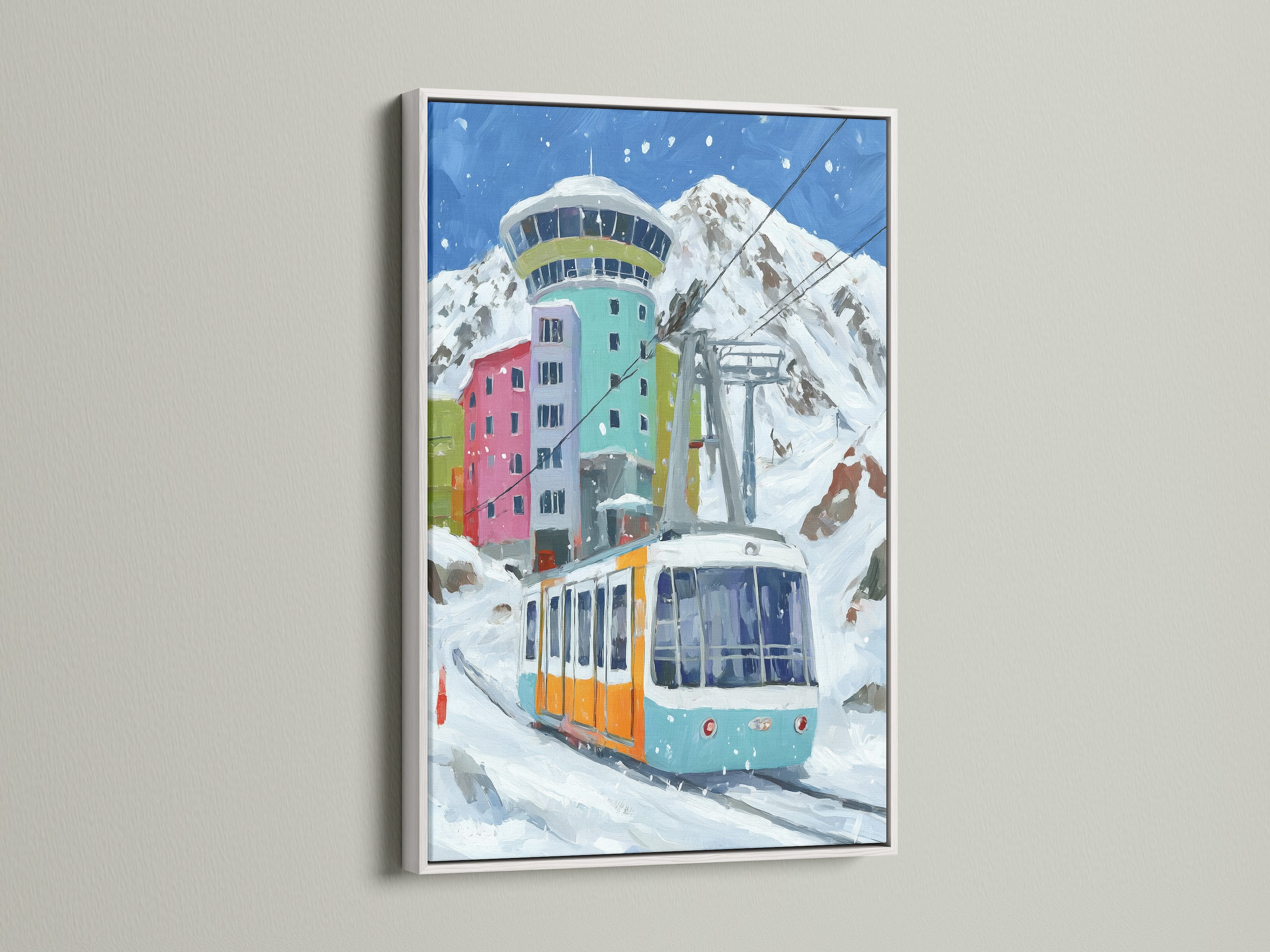 The alpine cable car art is displayed in a clean white frame. This winter wall art brings a colorful mountain village scene indoors. A perfect ski resort poster to enhance your chalet decor. The style is lodge.