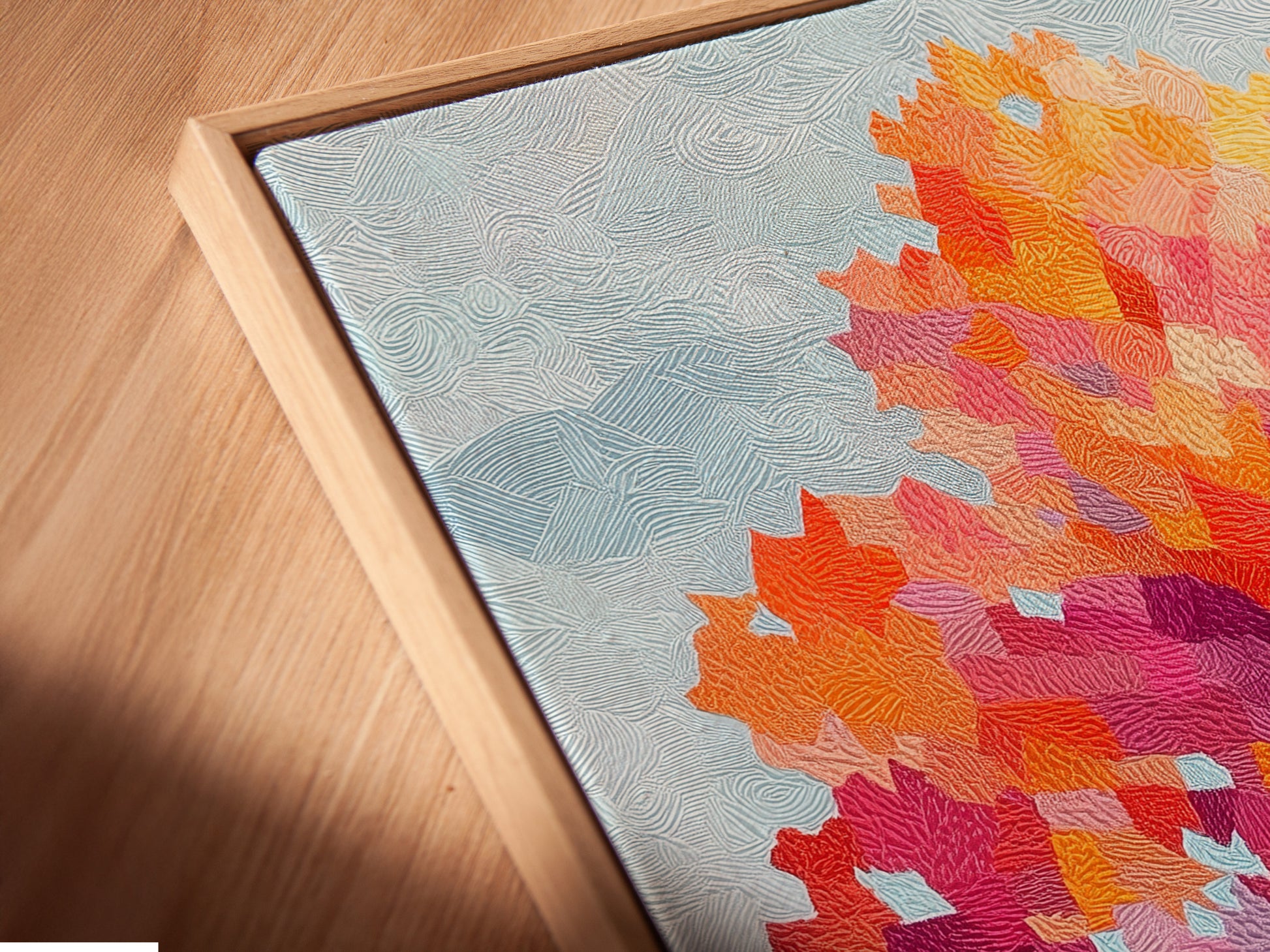 Angled close up of the Autumn Tree Canvas Print in a floating frame. The vibrant colors and contemporary artwork are highlighted. The floating frame adds depth and sophistication. This art piece is ideal for modern interiors. It suits nature-themed styles.