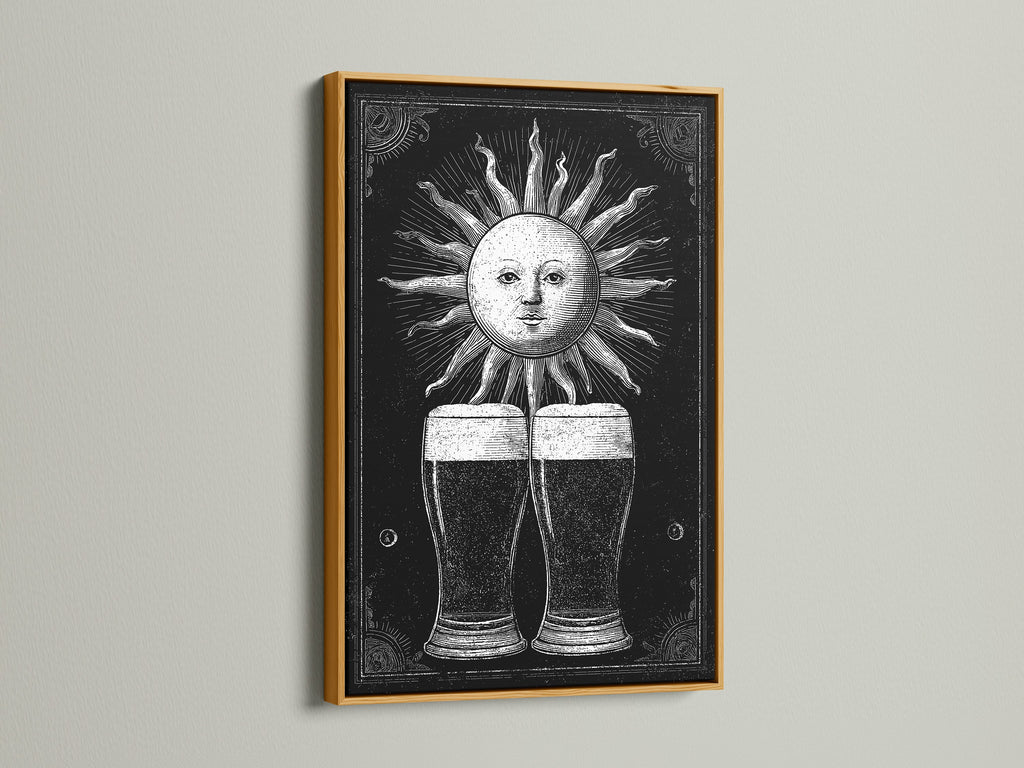 Vintage sun illustration artwork. The art print is framed in gold. The artwork features two beer glasses beneath the sun. Gold frames add a touch of elegance. Enhance your space with this striking piece.
