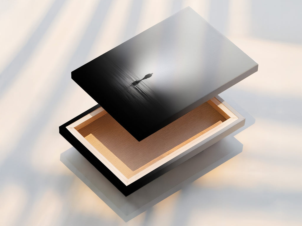 This is a stretched canvas print of minimalist solitude artwork. The foggy water reflection is beautifully displayed. This piece enhances contemplative art in any room. It is perfect for zen wall art.