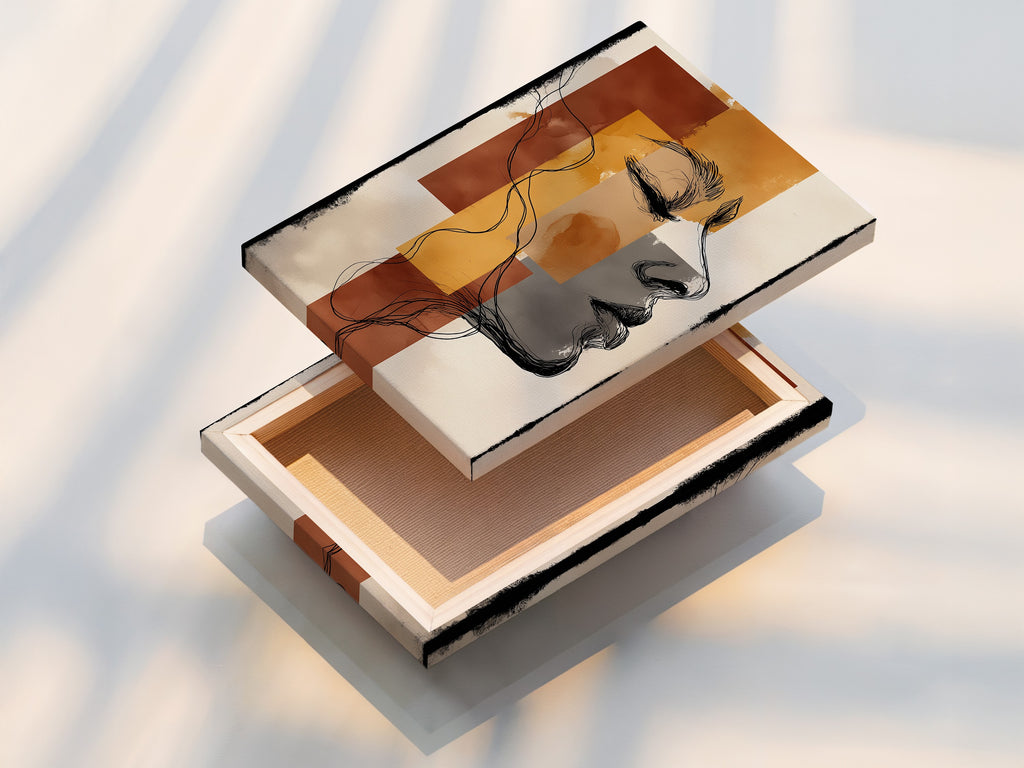 A stretched canvas print showcases an abstract woman profile art piece. The modern line drawing print adds a contemporary touch. Terracotta and mustard wall art tones create a warm ambiance. This minimalist art piece is ready to hang. It enhances any living space with its chic and artistic appeal. Perfect for creating a stylish focal point in your home.