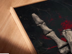 Angled close up of a canvas print featuring the Skeleton Hand Drumsticks artwork in a floating frame. The gothic wall decor is perfect for music lovers. It's a unique addition to any studio or home. This dark academia art piece brings rock culture to life.