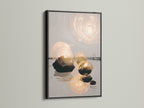 Abstract Zen artwork in a black frame. The balanced stone art enhances living room walls. This modern minimalist piece is great for office wall art. It adds a touch of contemporary style to any space. Explore serene prints for studios or lobbies. Elevate your decor.