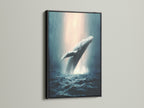 This is a whale canvas print in a black frame. It is ocean wildlife wall art. It features a humpback whale. This is marine life art. The whale artwork is perfect for coastal wall decor. It is a sea life print.