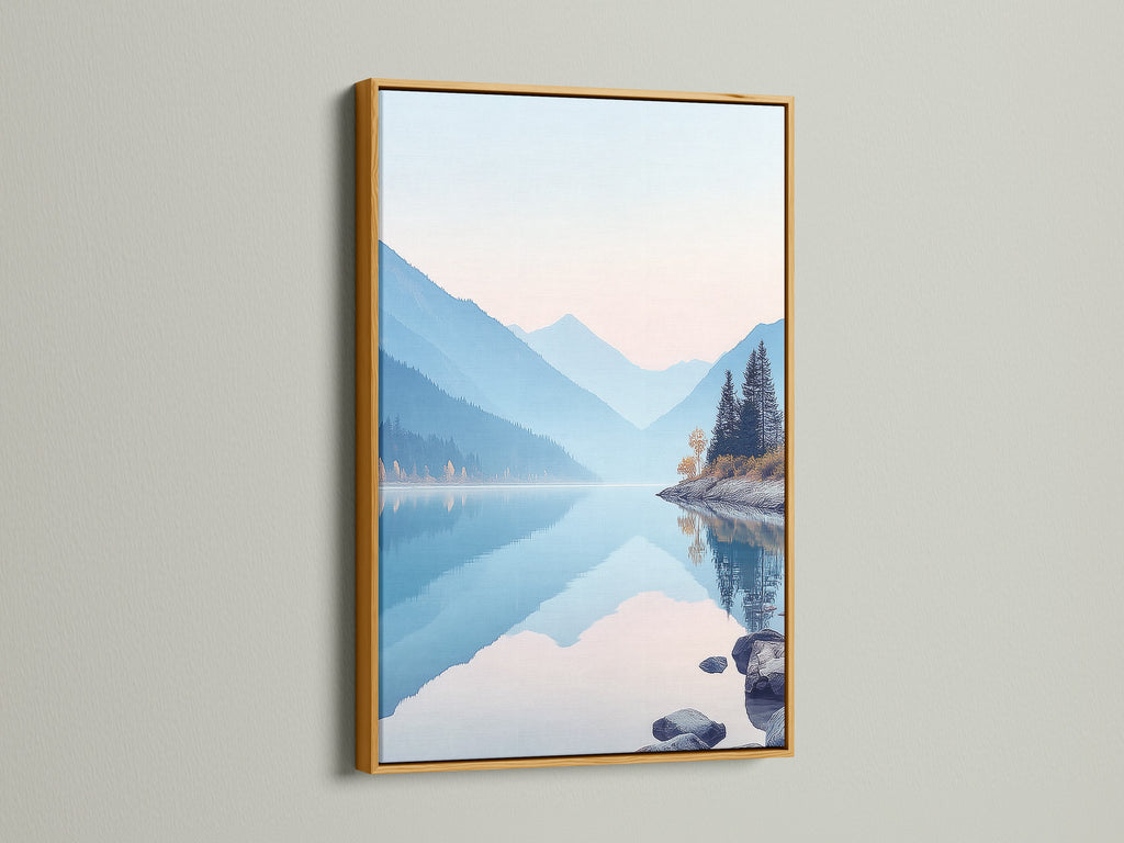 A gold frame highlights a mountain lake artwork. The serene nature landscape photography adds a calming touch. Pastel blue wall art enhances the room's decor. It is perfect for bedroom wall decor. The nature canvas print brings a peaceful mountain view. Ideal for minimalist interiors.