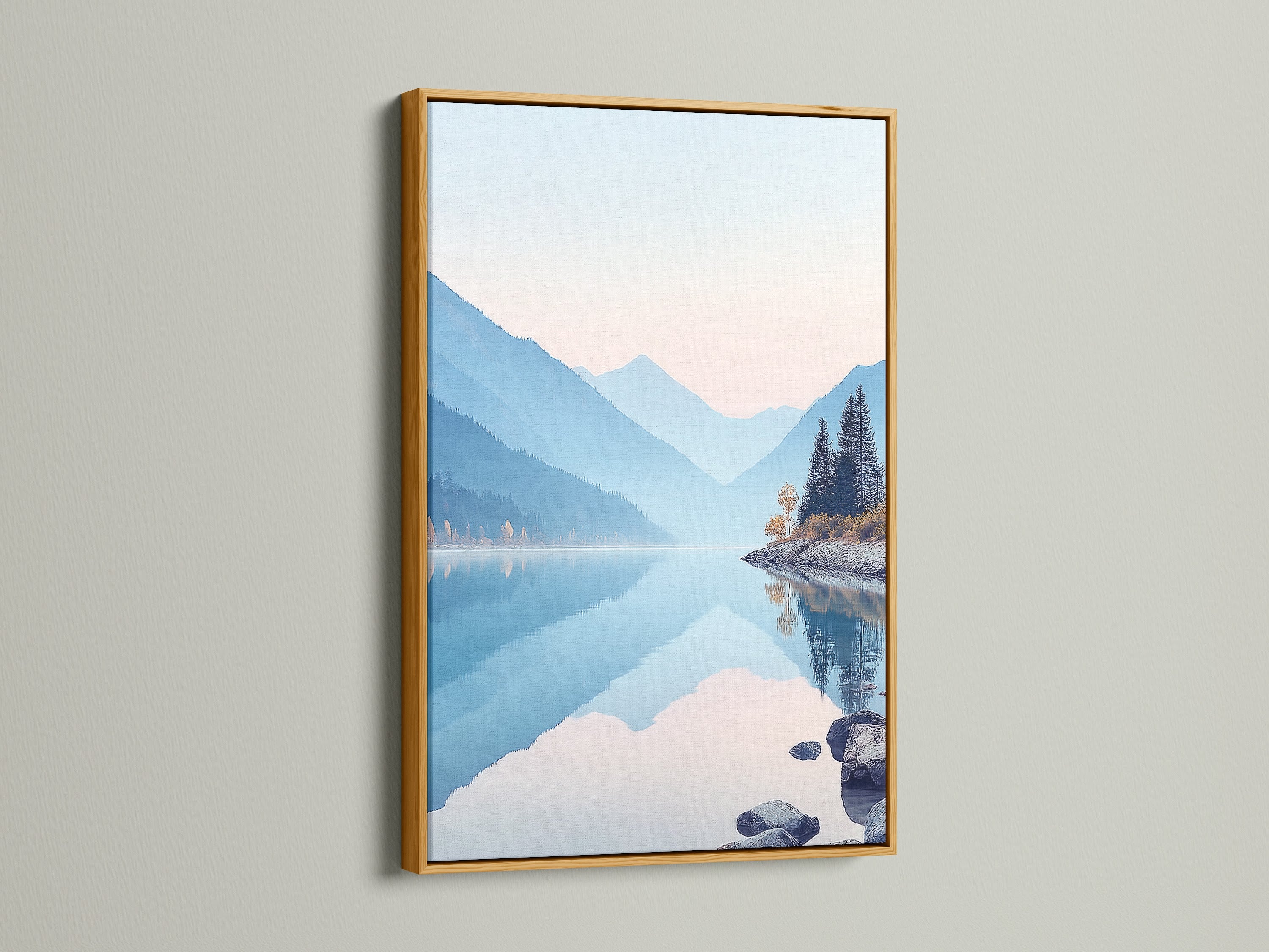 A gold frame highlights a mountain lake artwork. The serene nature landscape photography adds a calming touch. Pastel blue wall art enhances the room's decor. It is perfect for bedroom wall decor. The nature canvas print brings a peaceful mountain view. Ideal for minimalist interiors.