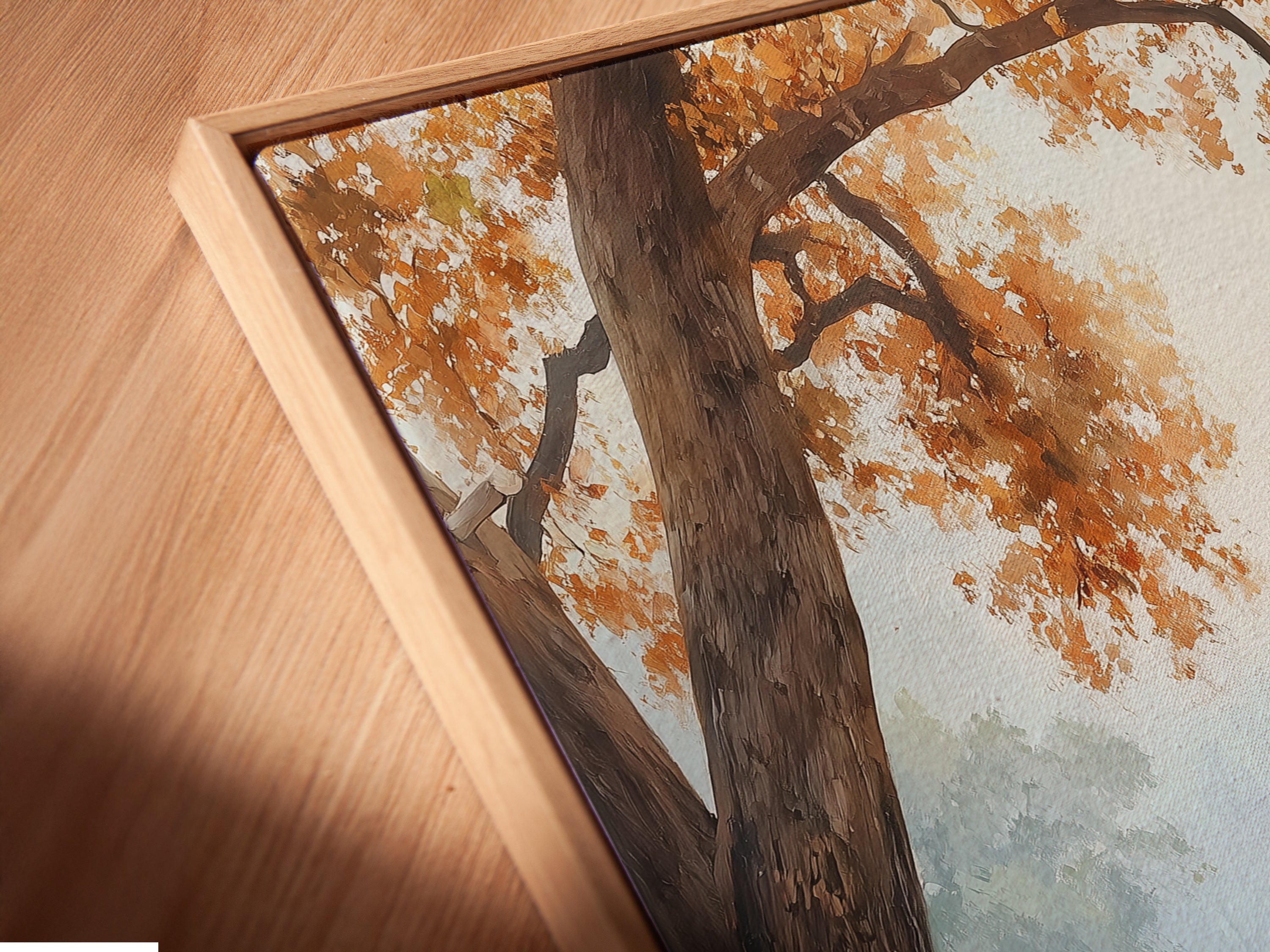 This is a close-up of a canvas print in a floating frame. The Italian Village Canvas Print is Tuscan Wall Art. The autumn landscape painting offers warm tones. It is ideal for rustic farmhouse or vintage decor styles.