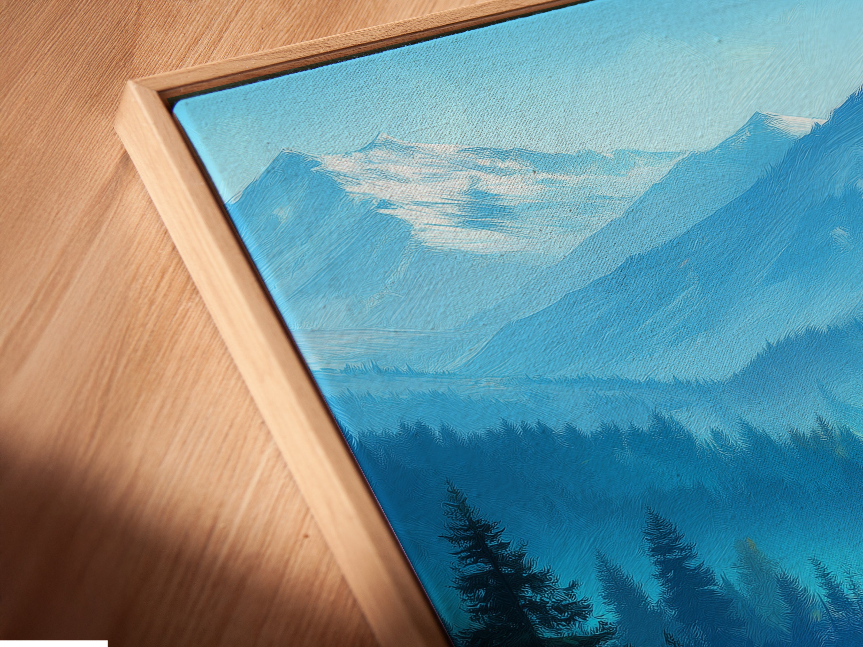 Close-up of a Mountain Landscape Canvas Print in a Floating Frame. This artwork features a colorful autumn forest and blue mountains. The floating frame adds a modern touch. Perfect for cabin decor or rustic wall art. Bring the beauty of nature into your home with this stunning piece.