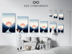 A size comparison chart is displayed in an interior setting. Showcasing the Sunset Silhouette artwork in various dimensions. This minimalist print can fit any space. The coastal sunrise artwork is available in multiple sizes. Find the perfect fit for your living room bedroom or office. Visualize how this modern landscape enhances your decor.