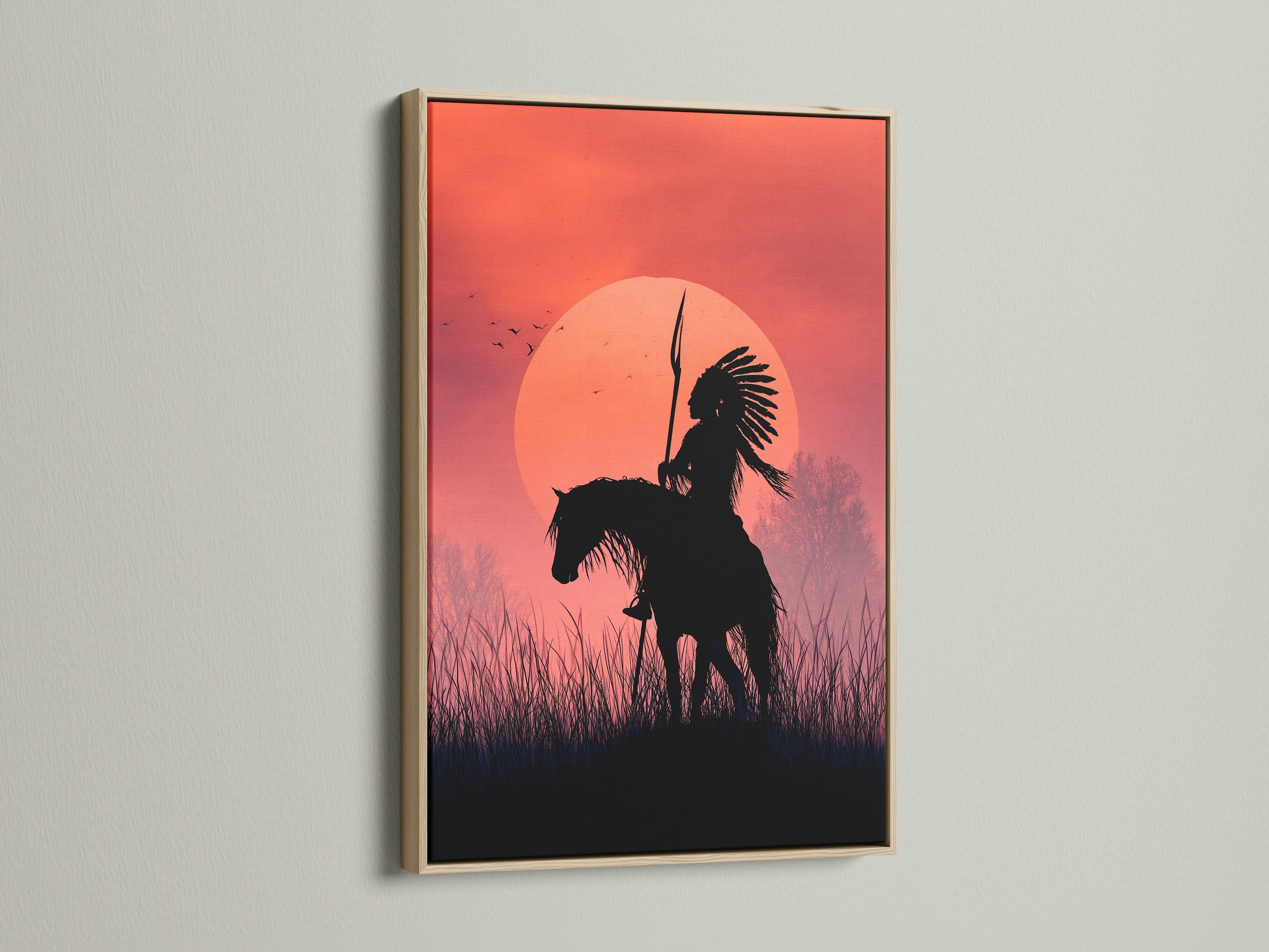 This is a framed artwork. The artwork depicts an indigenous person on horseback at sunset. The frame is made of oak. This wall art adds a touch of nature to any room. Perfect for home decor and art lovers.