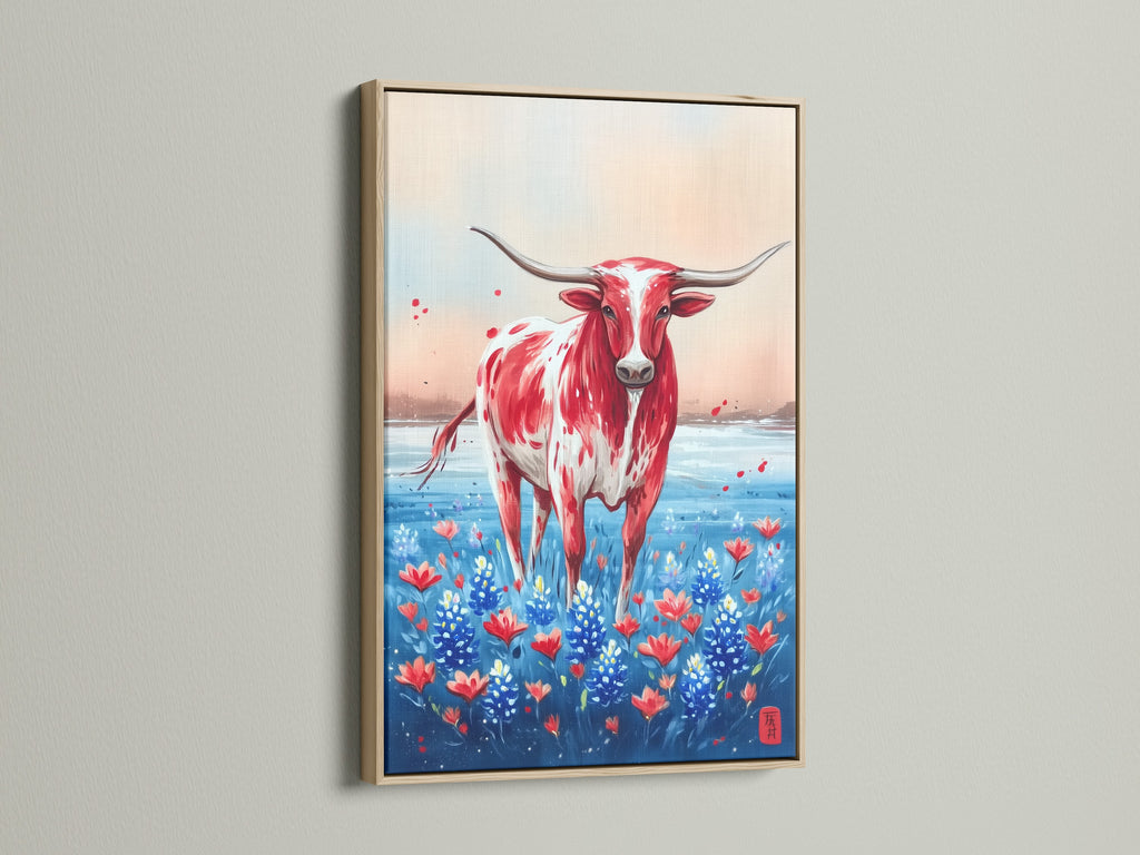 Texas Longhorn art in an oak frame. The artwork showcases a red and white Longhorn in a wildflower field. Bring western charm to your home with this canvas art. Perfect farmhouse wall decor for a dining room.