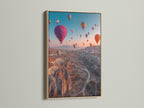 A vibrant Cappadocia print is showcased in an oak frame. The travel wall art captures the beauty of the landscape. The oak frame enhances the artwork. It adds a touch of natural elegance to the scene.