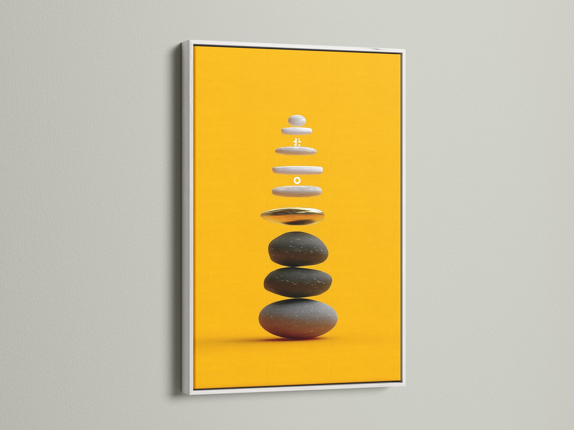 Zen Stone Canvas Print with a White Frame. This modern artwork enhances any room. The white frame complements the ochre yellow tones of the balancing stones art. A serene canvas for yoga studios.