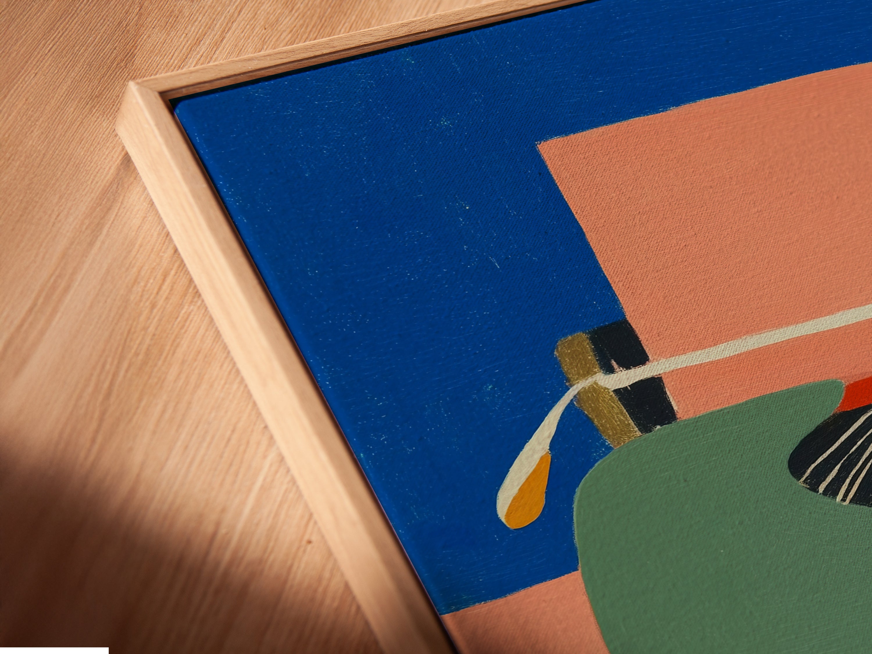 Close-up of a canvas print in a floating frame. This typewriter artwork is mid-century modern. Perfect for office wall art and study room decor. This retro office decor adds a vintage touch. Ideal as a unique gift for writers. The artwork features blue and orange tones.