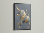 The golden bull artwork with a black frame is displayed. This modern art print offers a bold statement. The animal canvas suits rustic or industrial decor. It's ideal for masculine spaces like offices. The minimalist art complements various interior styles. Add a touch of elegance to your walls.