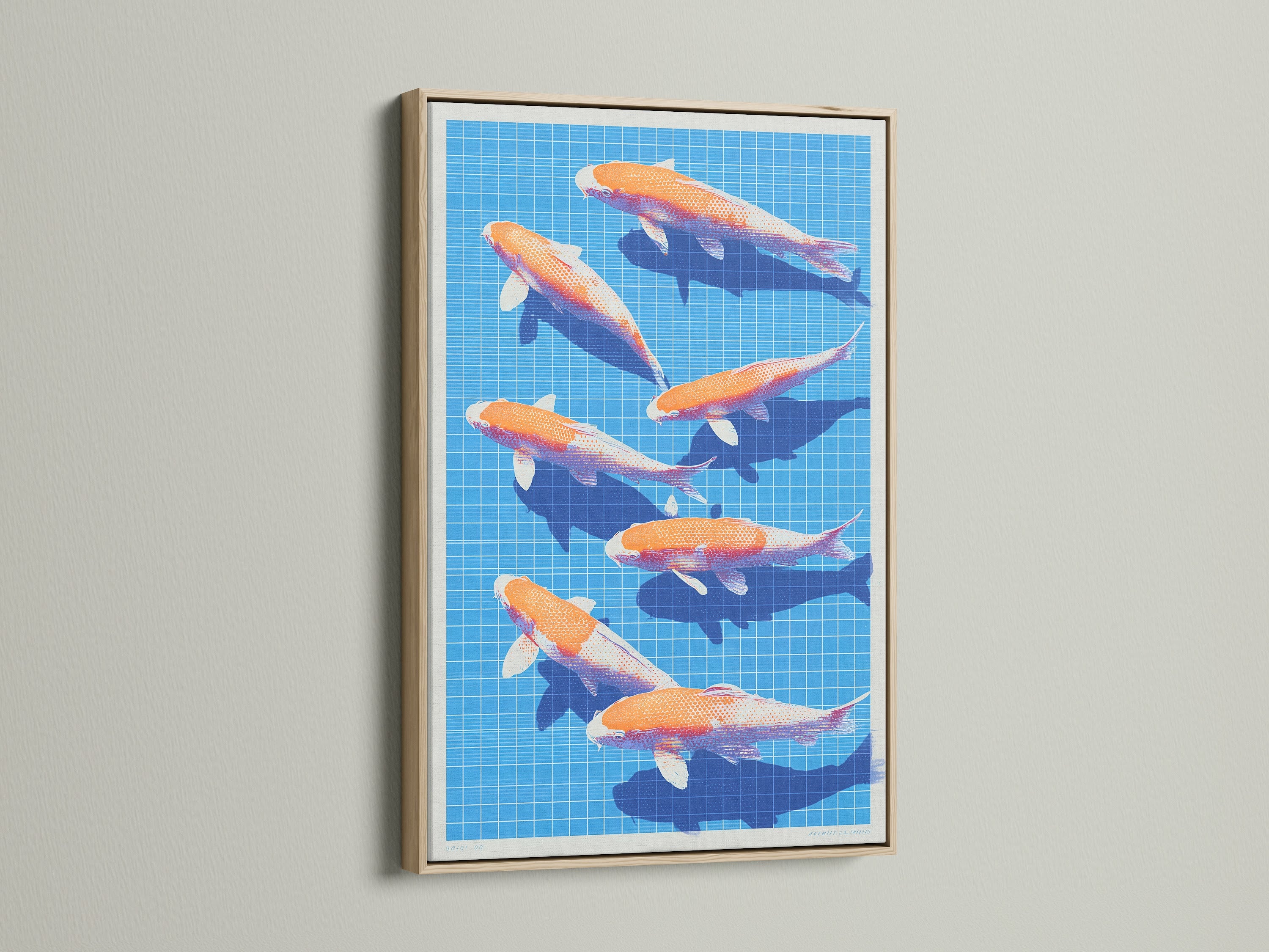 Close-up of an oak framed Koi Fish canvas artwork. The modern Japanese print features orange and white Koi fish swimming on a blue grid. The serene art is ideal for minimalist Scandinavian or coastal style spaces.