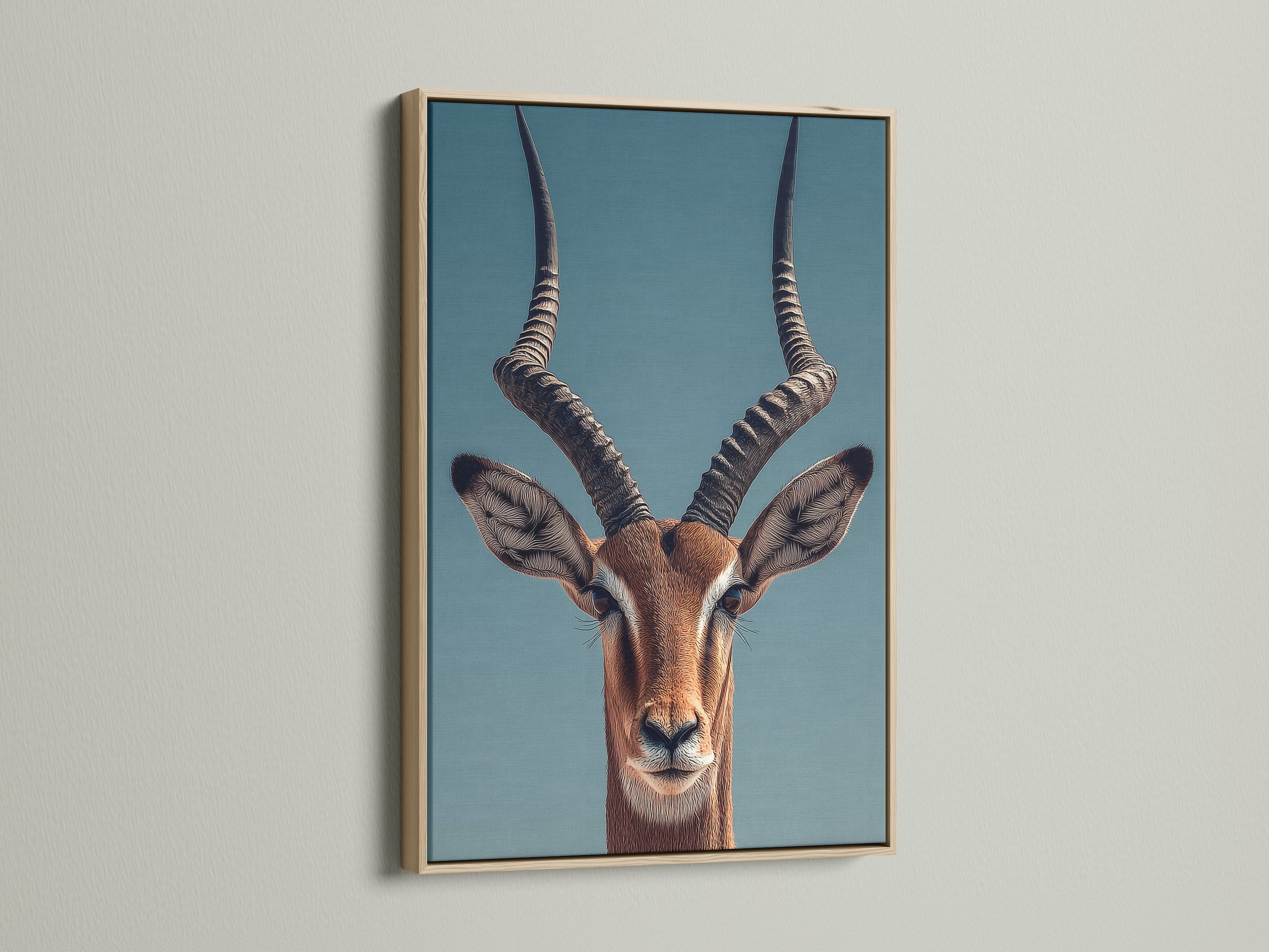 A close up of an Impala art print is displayed. The print is framed in a natural oak frame. The frame enhances the artwork. The frame adds warmth to the room.