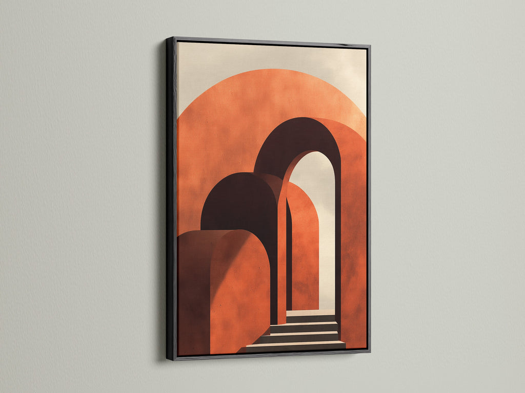 Artwork with a sleek black frame is mounted on a white wall. The art has terracotta arches. A black frame provides a bold contrast. It adds sophistication and highlights the artwork's colors and forms.
