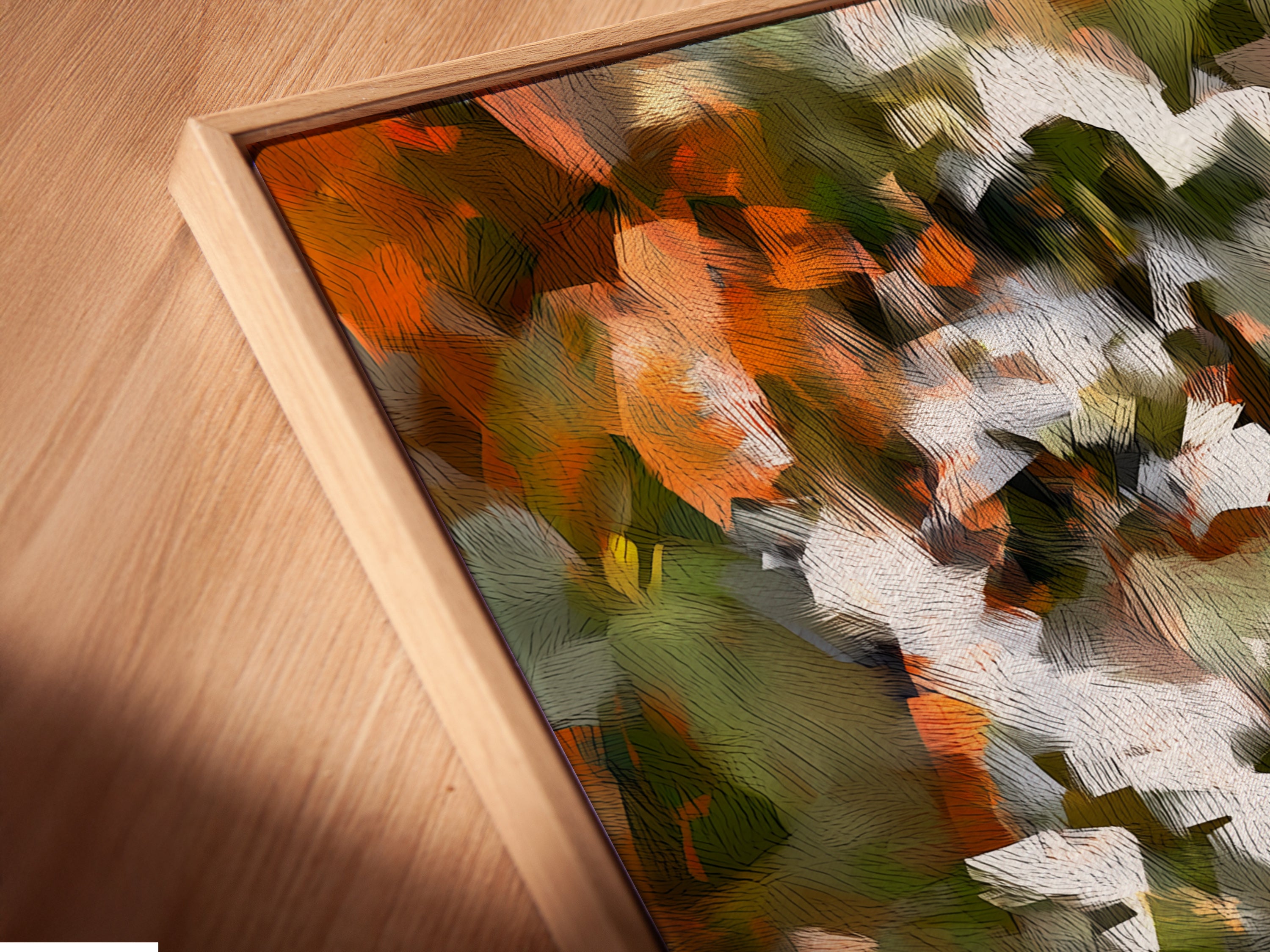 A close-up shot shows a canvas print in a floating frame. The abstract floral art has orange green and white colors. The floating frame adds depth and sophistication. Perfect for adding a gallery-like touch to your home. This artwork is a modern masterpiece.