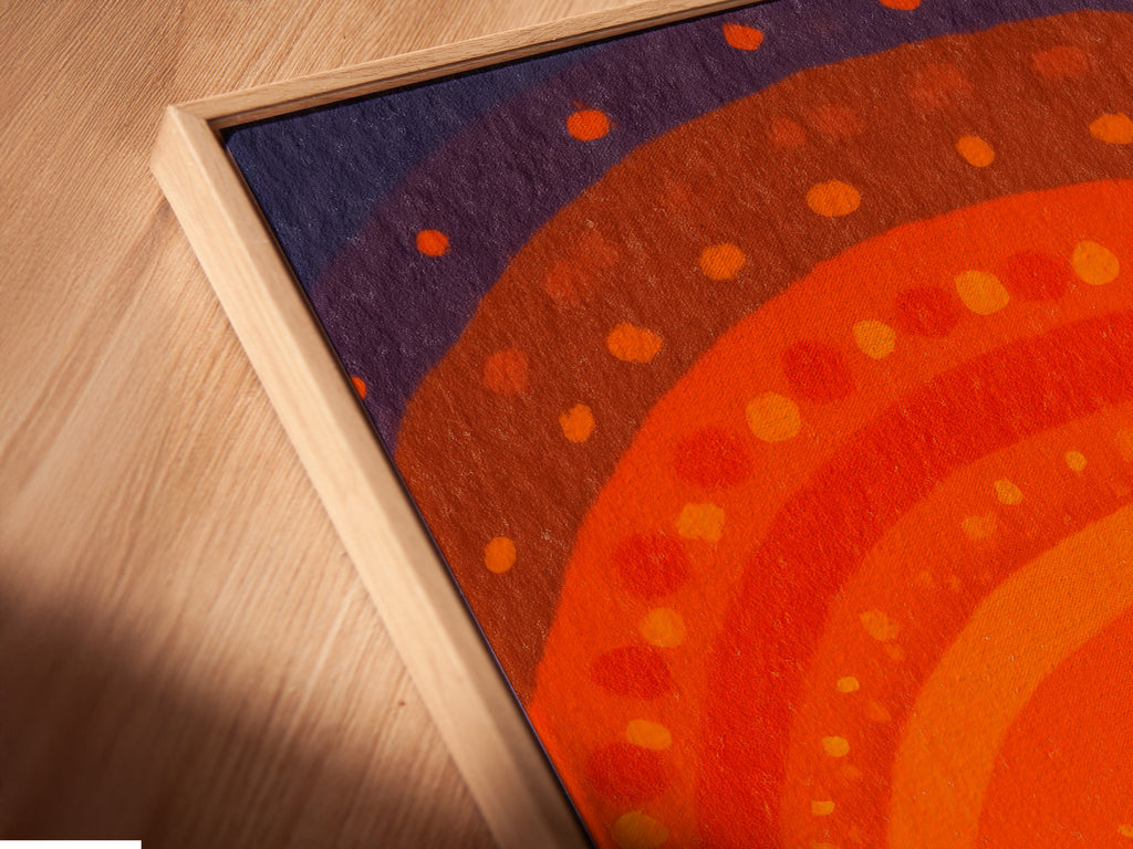 A close-up angled view of the Sunset Boats canvas print in a floating frame. The frame enhances the artwork's depth and dimension. Perfect for those seeking modern home decor with a mid-century modern touch. The ocean art print is ready to hang.