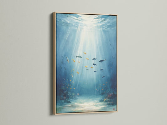 Underwater artwork with an oak frame. This ocean canvas print showcases sea life wall art. The fish painting adds aqua blue decor to any space. Enhance your coastal wall decor with marine life art.