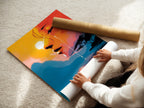 A woman is carefully rolling a fine art poster paper. This surreal portrait art displays an abstract face and a sunset lake reflection. It is ideal for contemporary art collectors and enthusiasts.