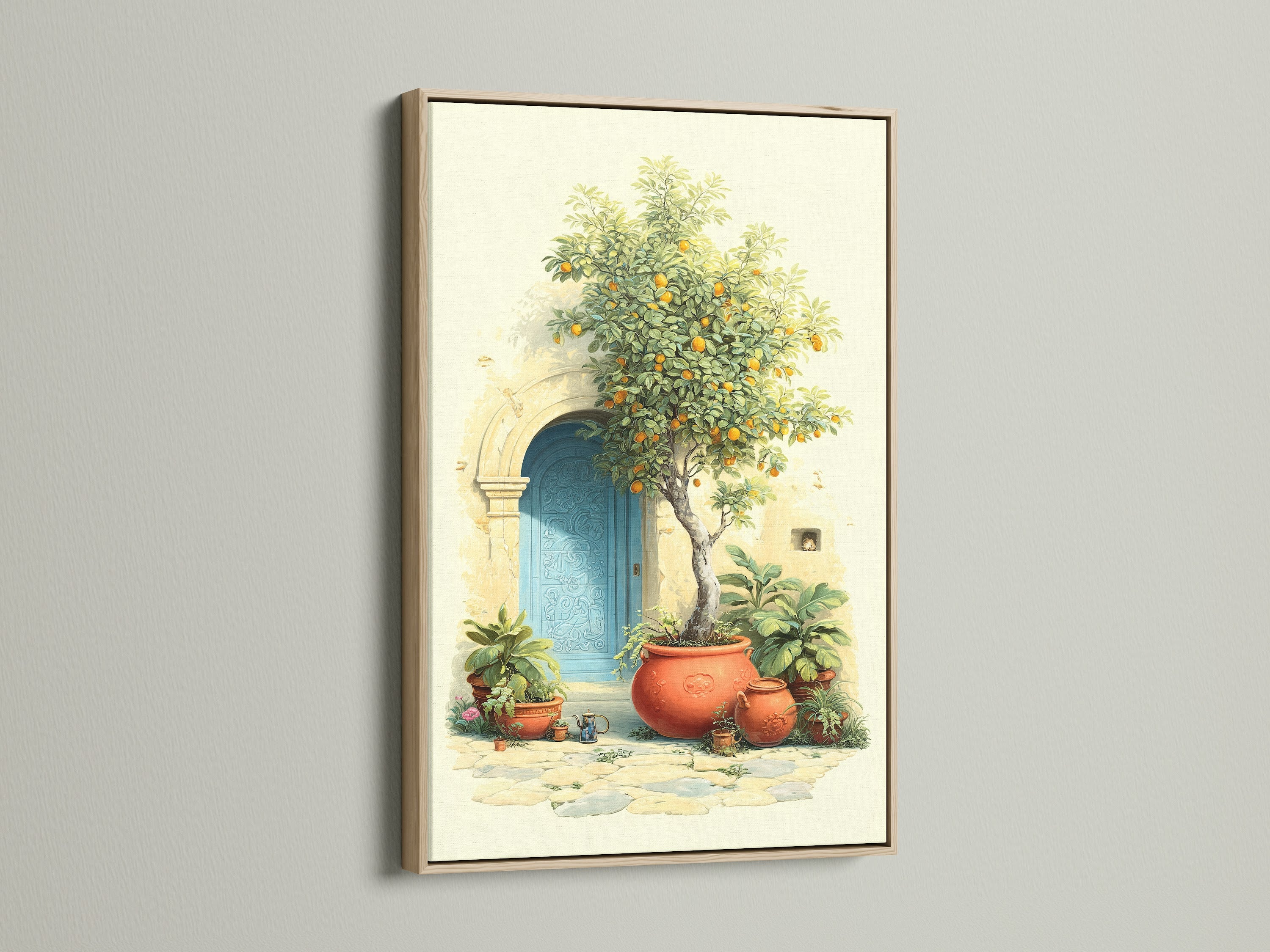 Italian Lemon Tree canvas print with an oak frame. The Tuscan doorway artwork adds a touch of Mediterranean decor to any kitchen. It brings a vintage coastal feel with its azure door terracotta pots and citrus elements. Enhance your home with this Italian print.