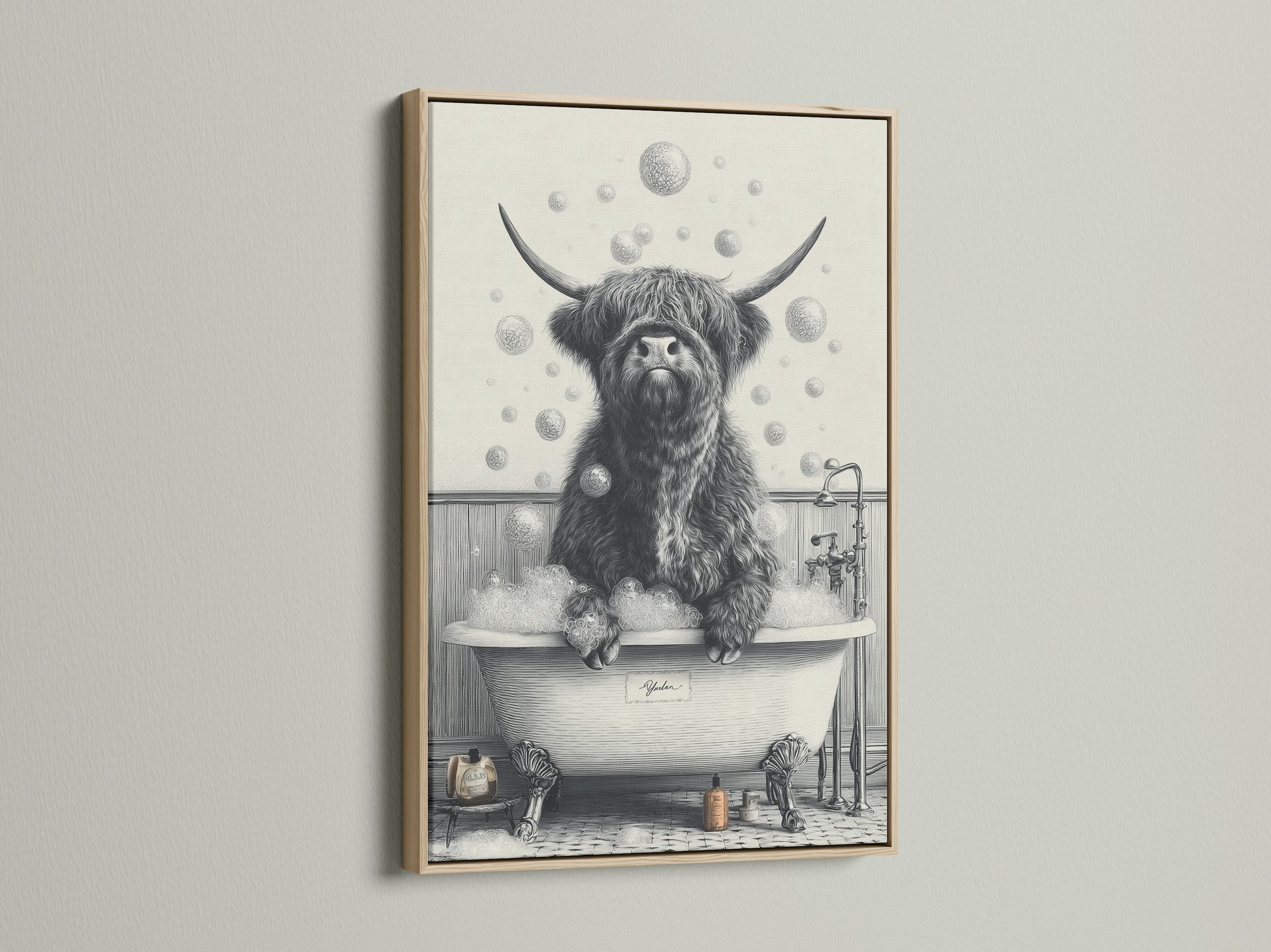 This image displays a framed highland cow art print. The frame is made of oak. This funny animal art brings a rustic touch. Ideal as a cow in tub print for unique wall art. It enhances any farmhouse decor.