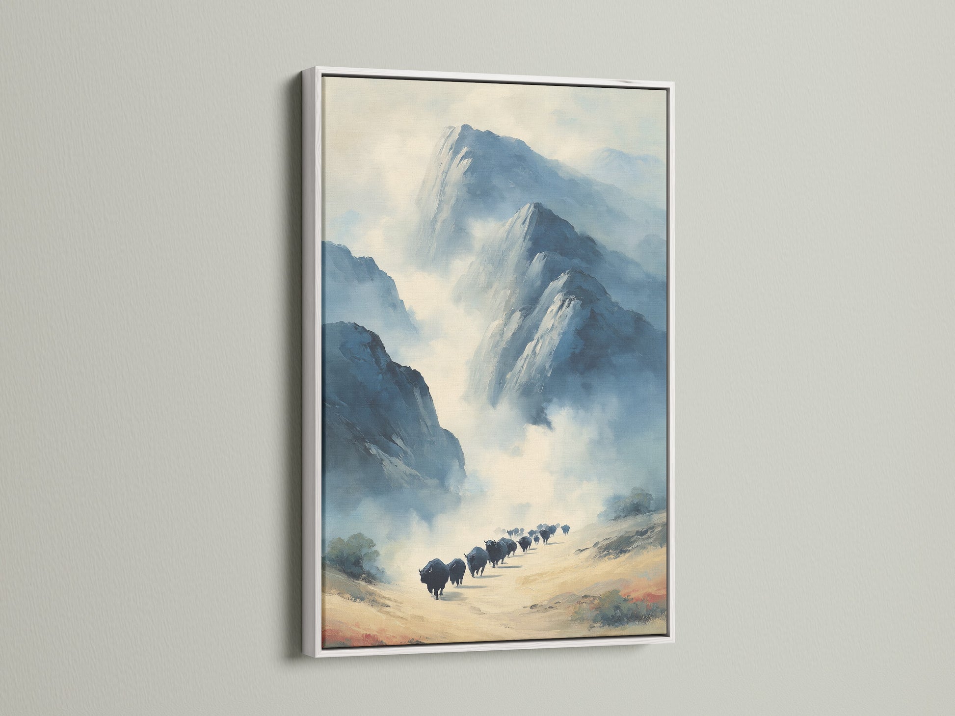 Artwork with a white frame. This mountain landscape print enhances any room. The neutral tones create a serene environment. The white frame provides a clean modern look. It is ideal for contemporary styles. This buffalo art is suitable for bedroom wall decor. Its design makes it a versatile piece for various settings. The white frame adds elegance.